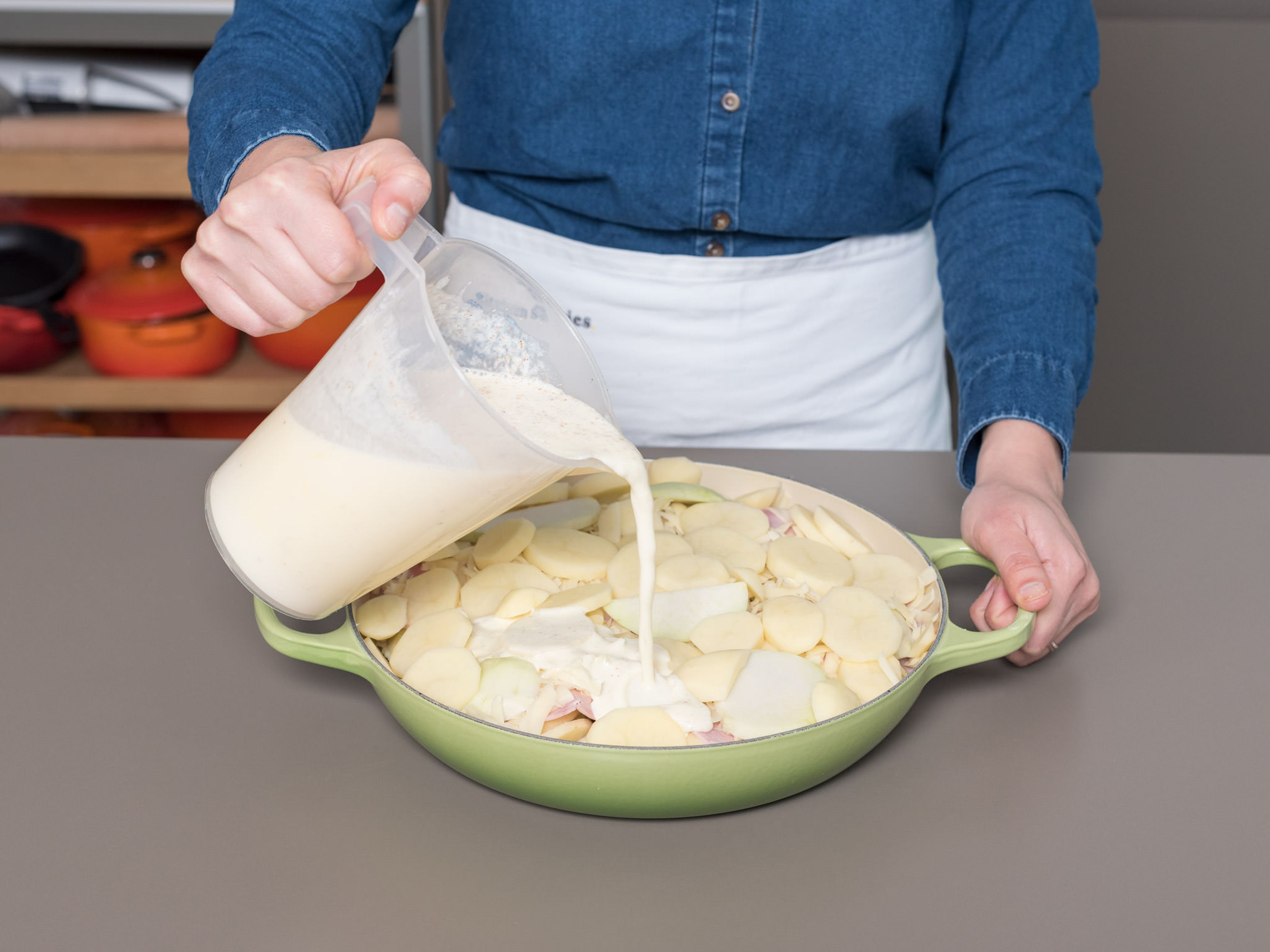 Pour the cream mixture over everything, and top off the casserole with the remaining cheese and oats.