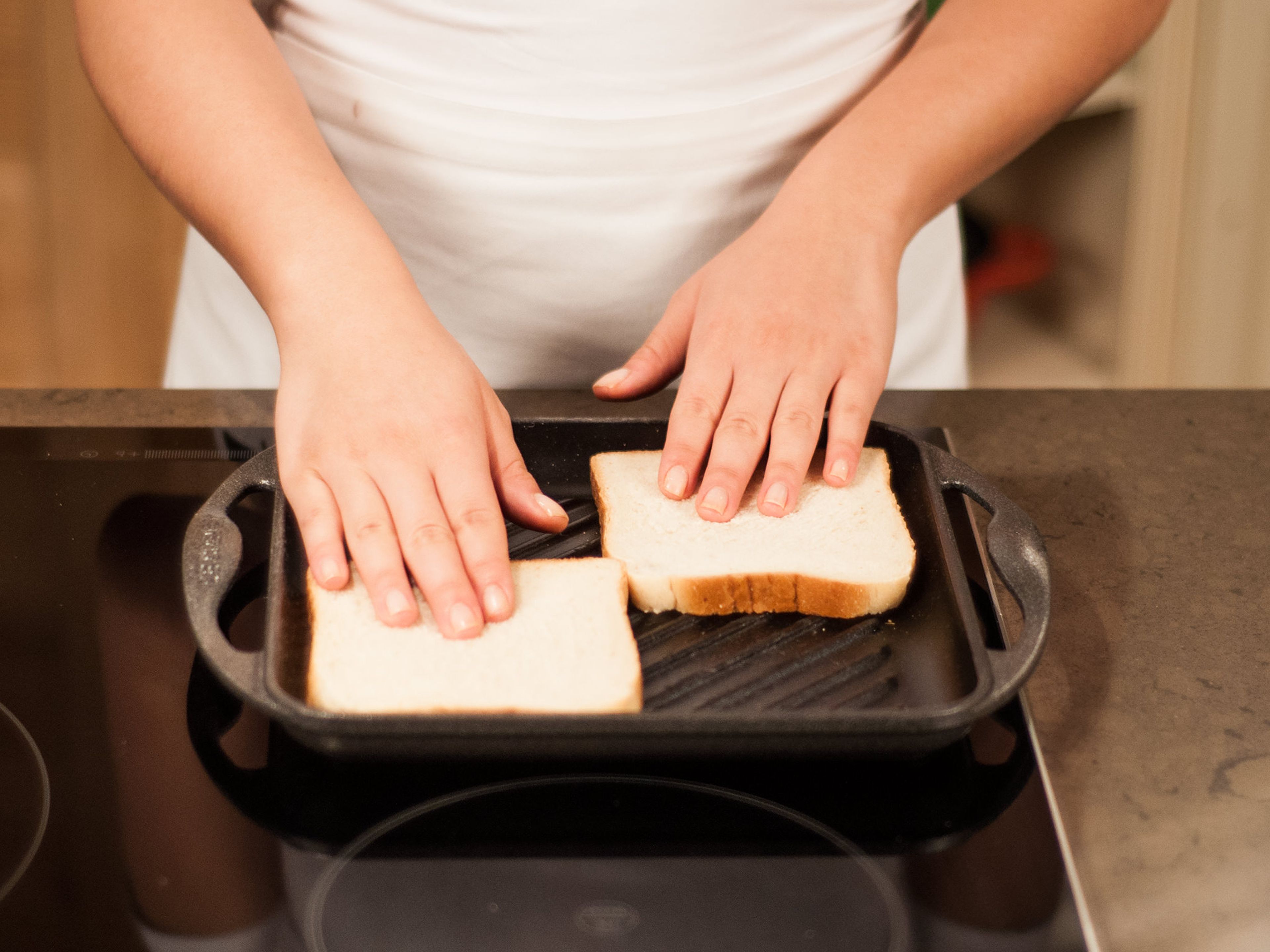 Toast bread slices on a grill pan over medium heat for approx. 1 – 2 min. per side.