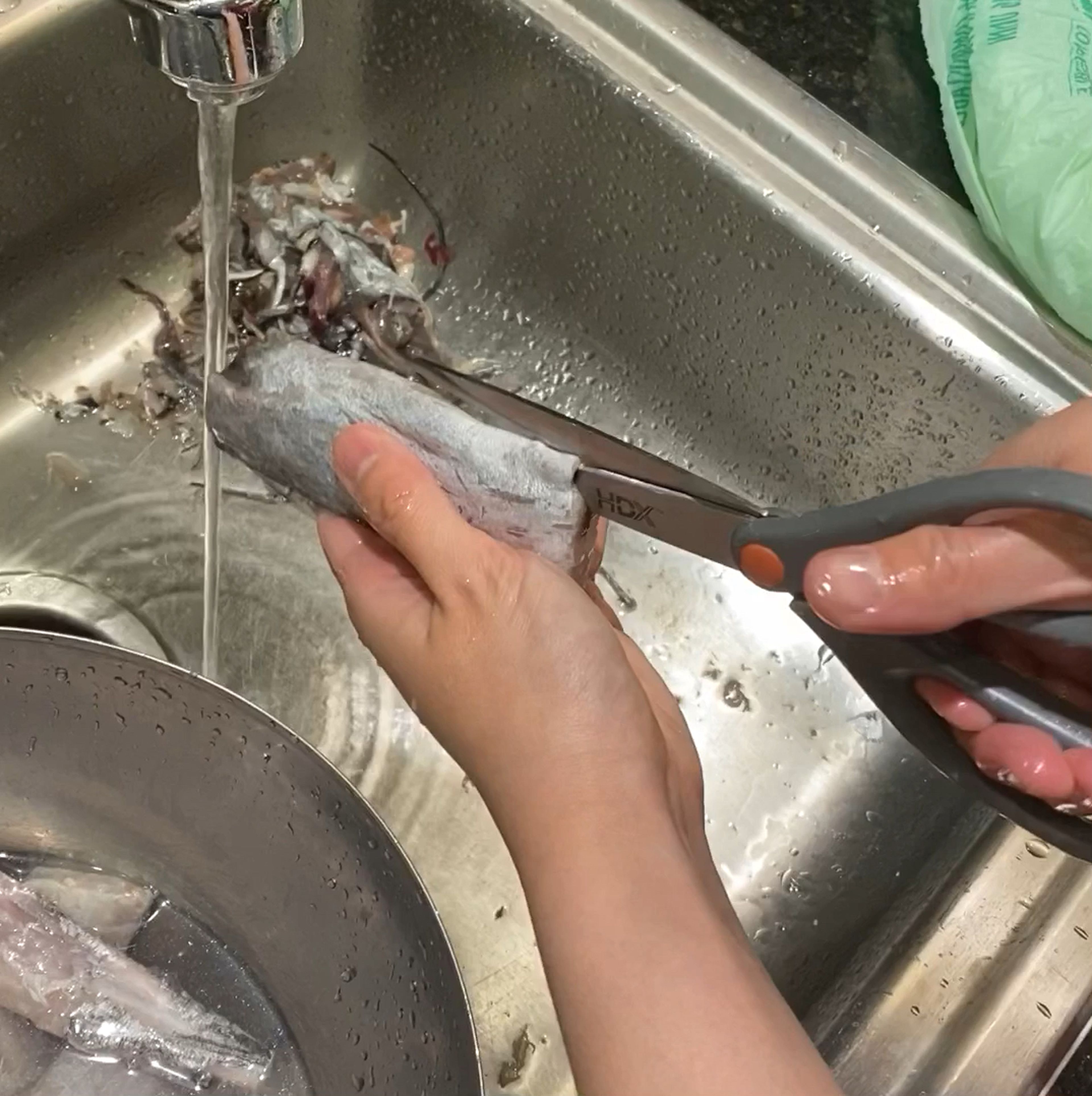 Clean beltfish thoroughly by removing its intestines and scales.