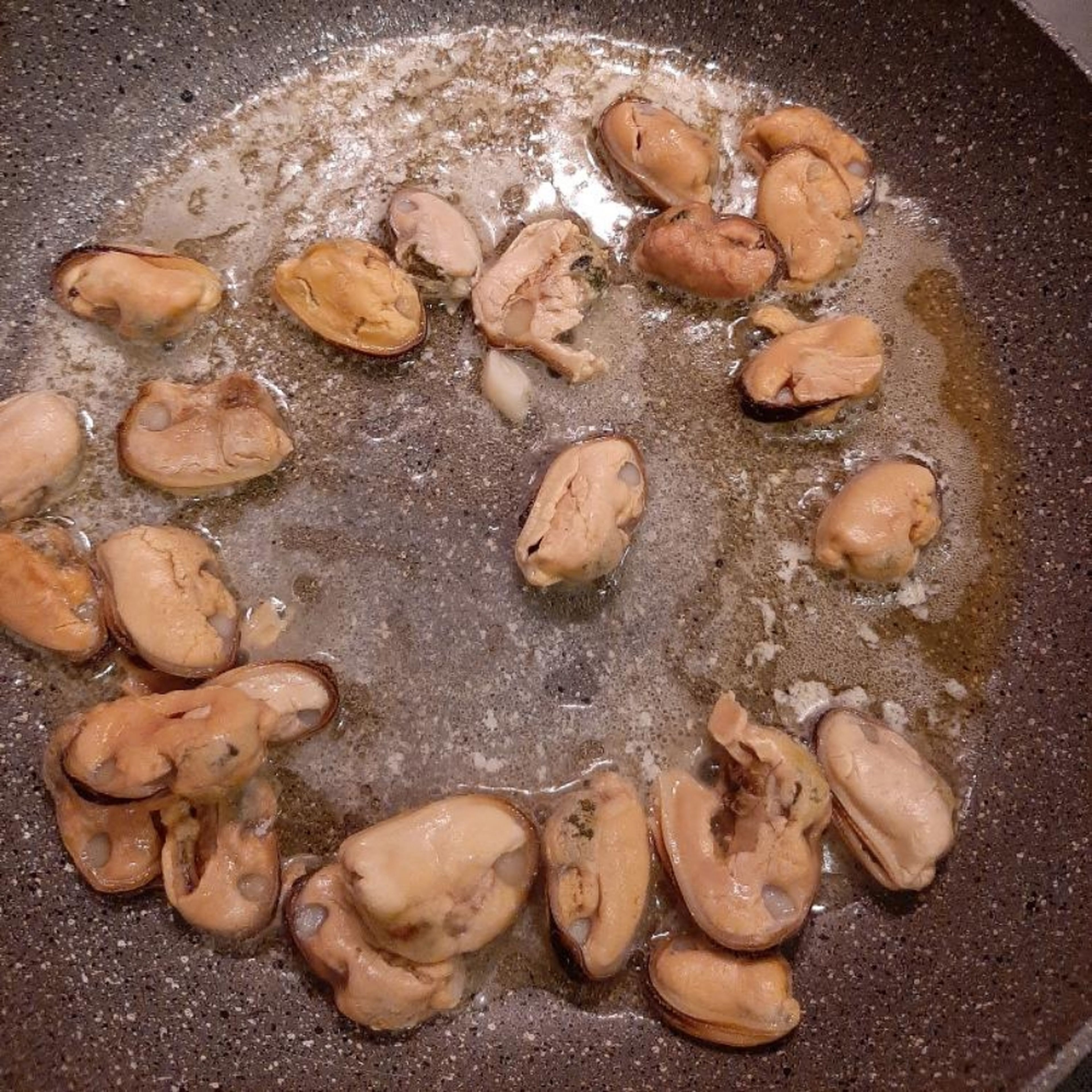 Put butter in the pan Then just take the mussels and place them in the pan