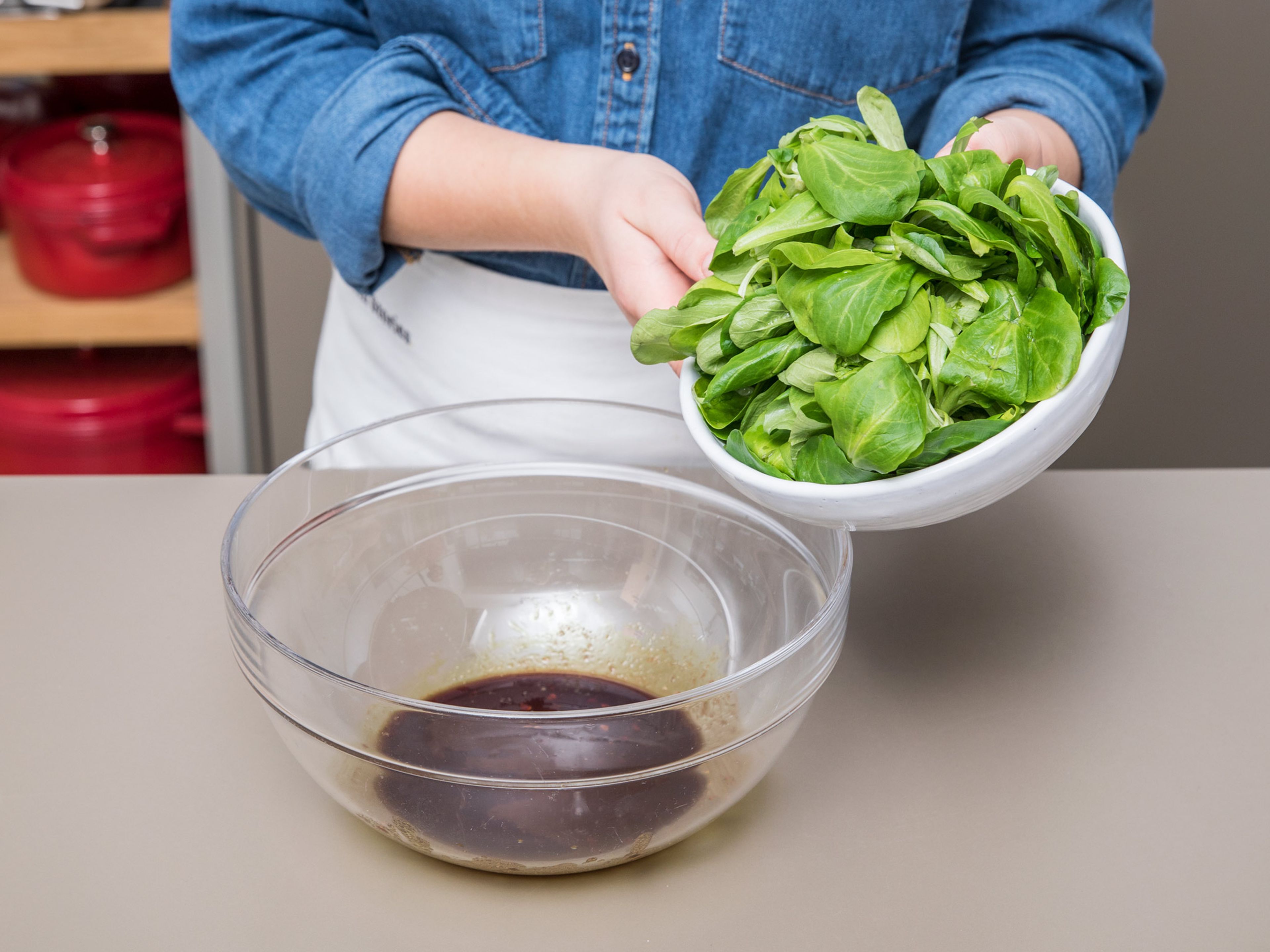 In the meantime, to make the salad, add olive oil, mustard, pumpkin seed oil, balsamic vinegar, sugar, salt, and pepper to a large bowl and mix. Add lamb’s lettuce and toss well to coat with the dressing. Serve with the warm baked Brie and enjoy!