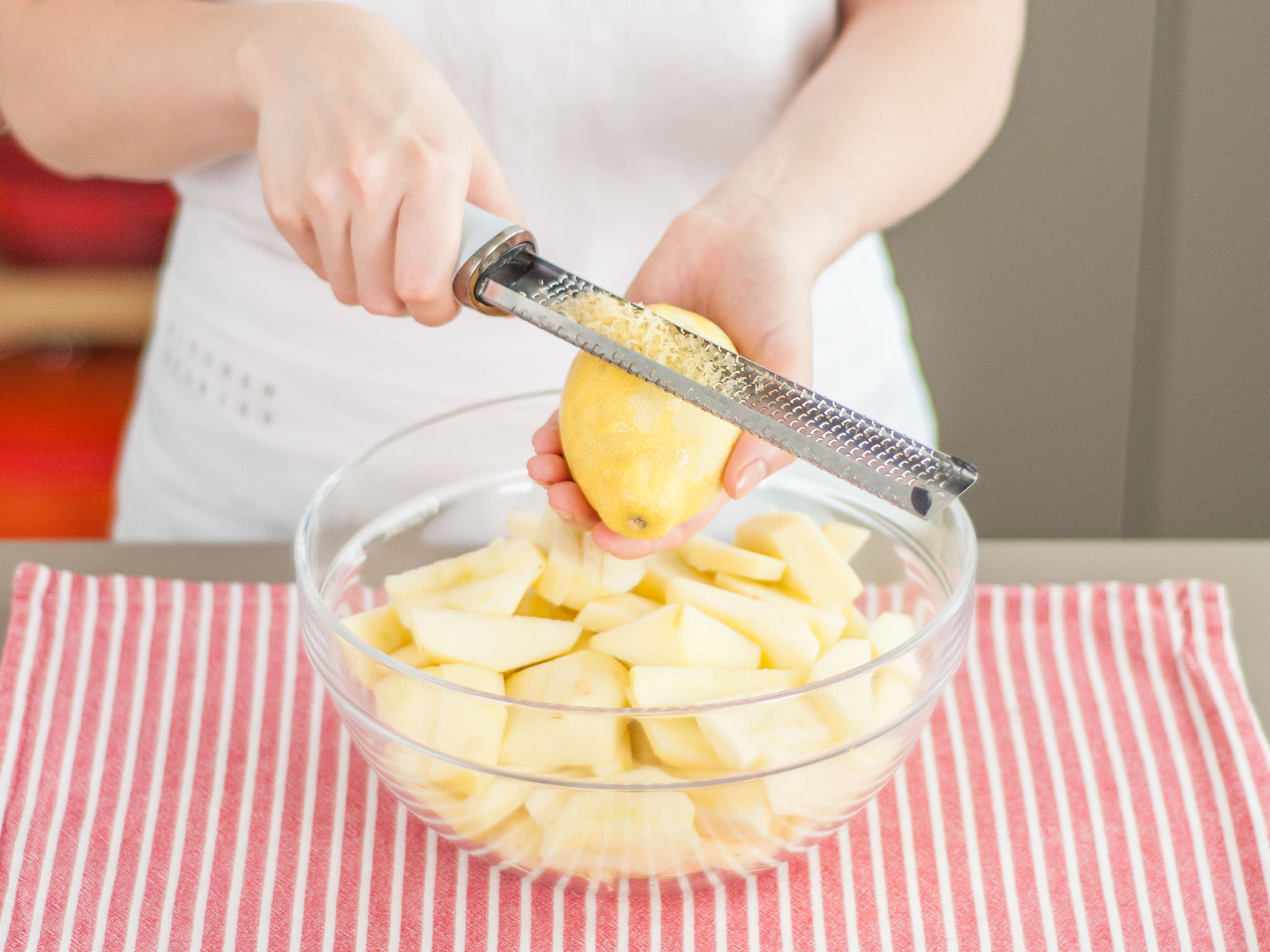 Toss apples with lemon juice and zest and set aside.