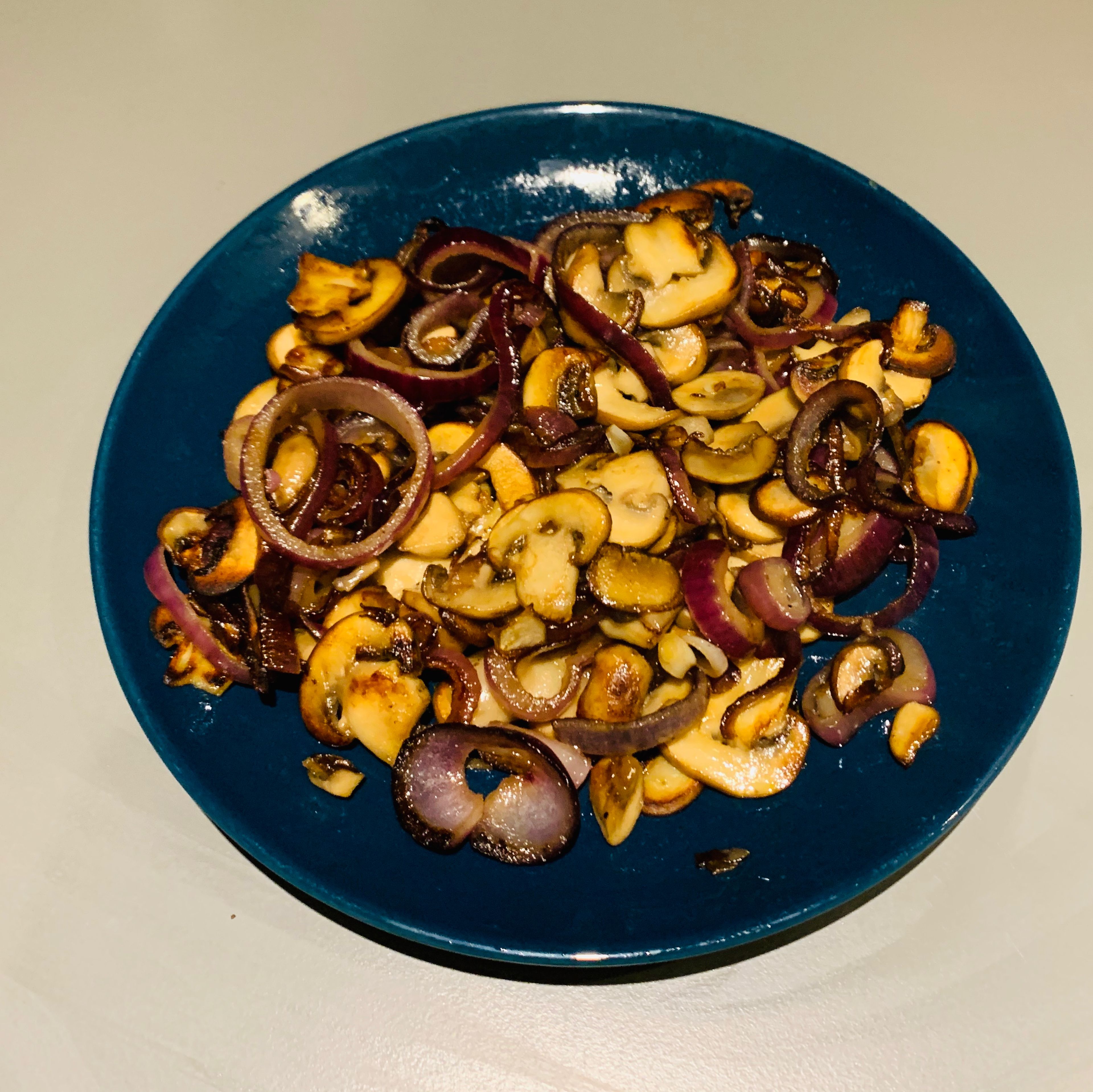 Lightly roast the onions and mushrooms in a pan