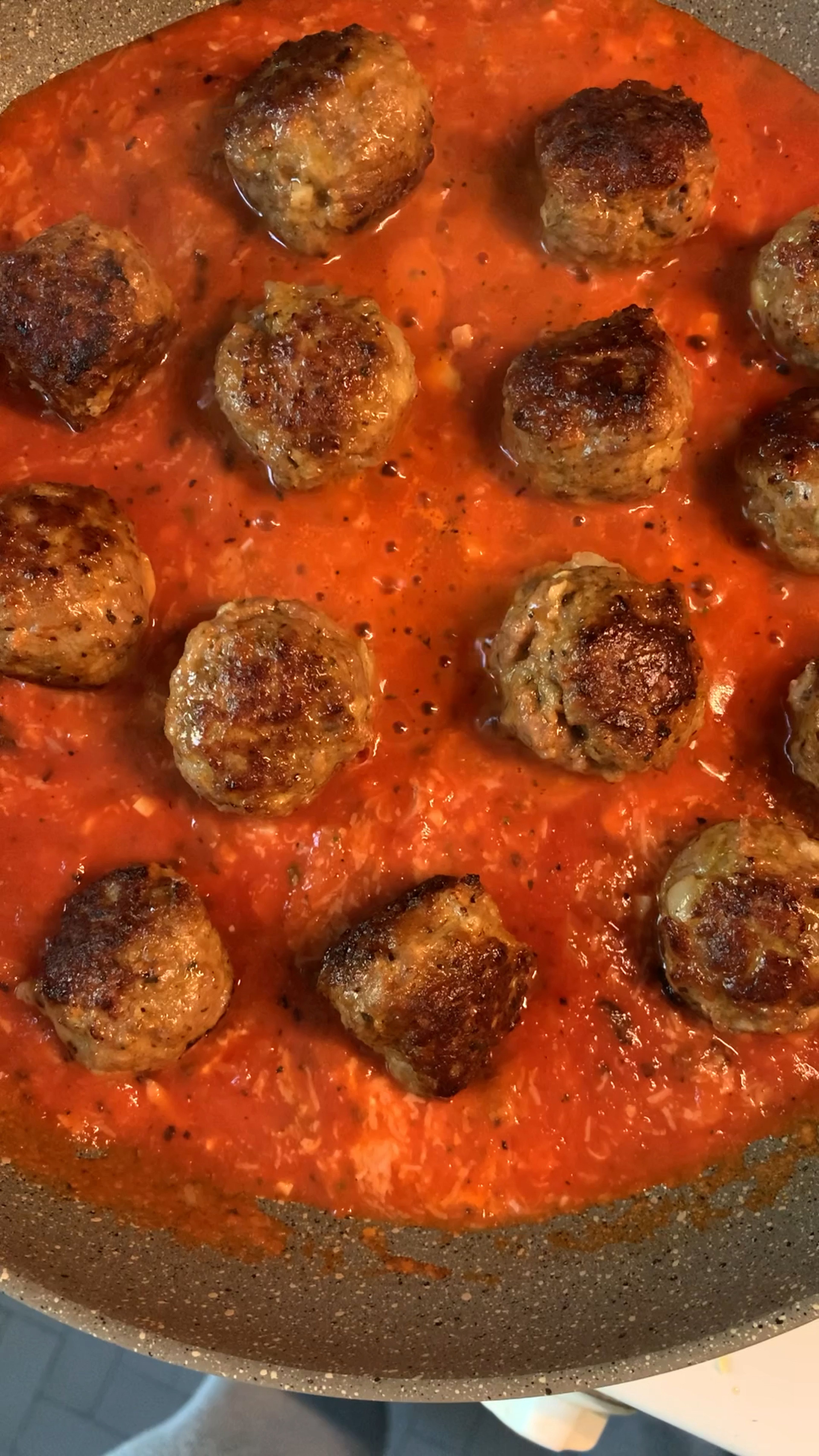 Add meatballs to the tomato sauce and stir. Let the sauce cover all the meatballs.