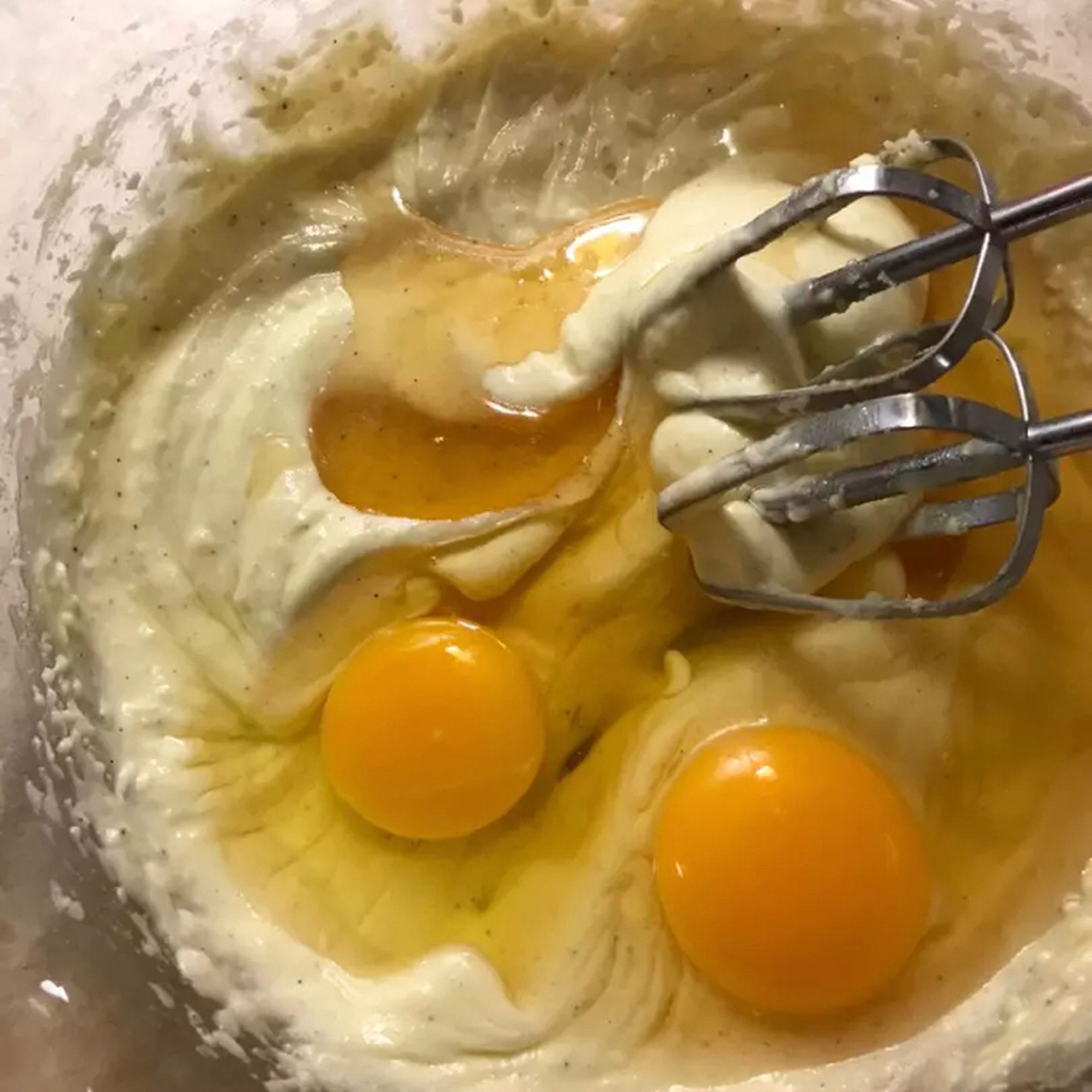 Add eggs, honey, vanilla and cardamom and mix.