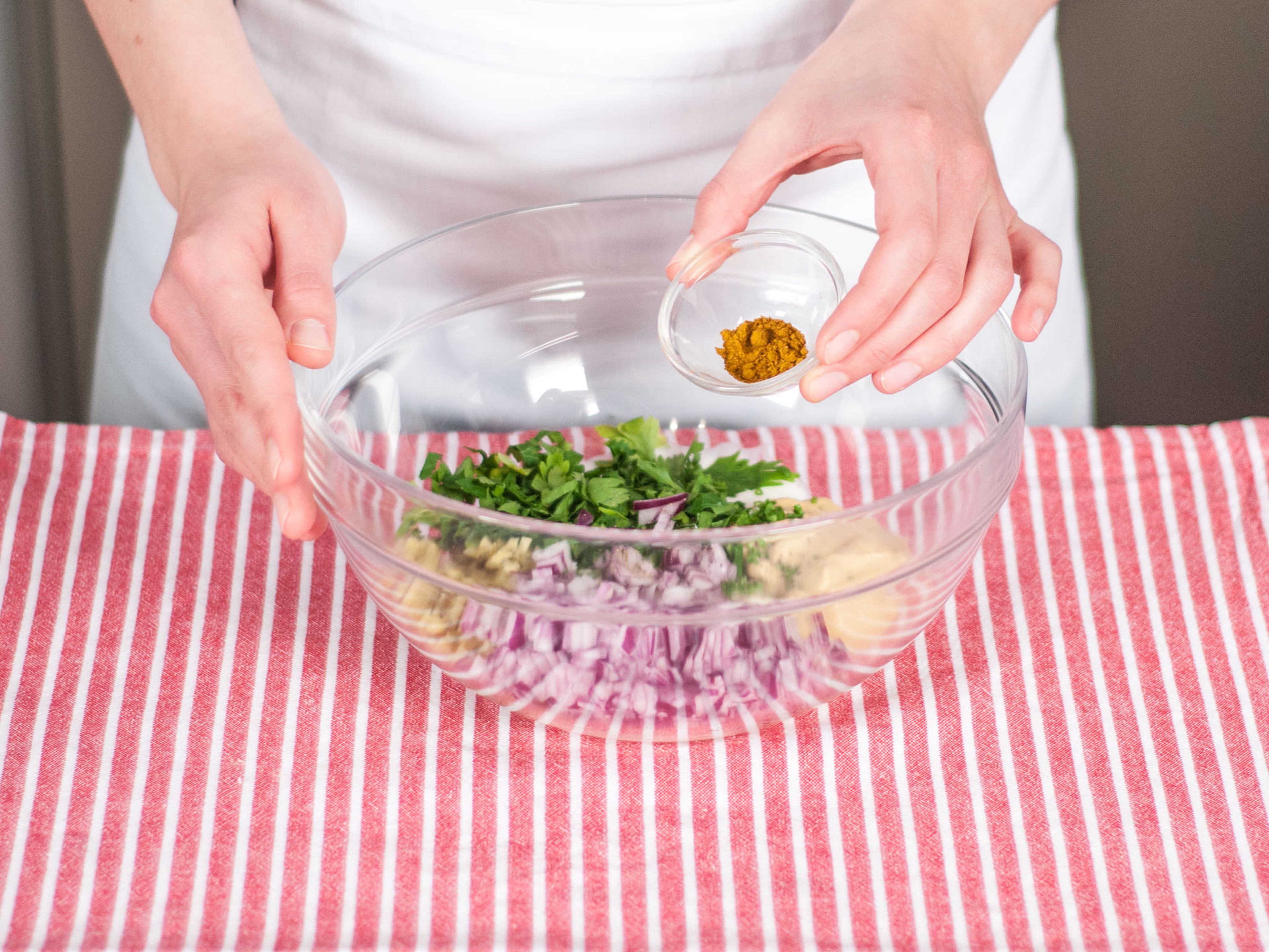 For remoulade, squeeze lemon juice into a large bowl. Add remaining pickles and red onion, chopped parsley and chives, yogurt, mayonnaise, and curry powder. Season with salt and pepper and mix well.