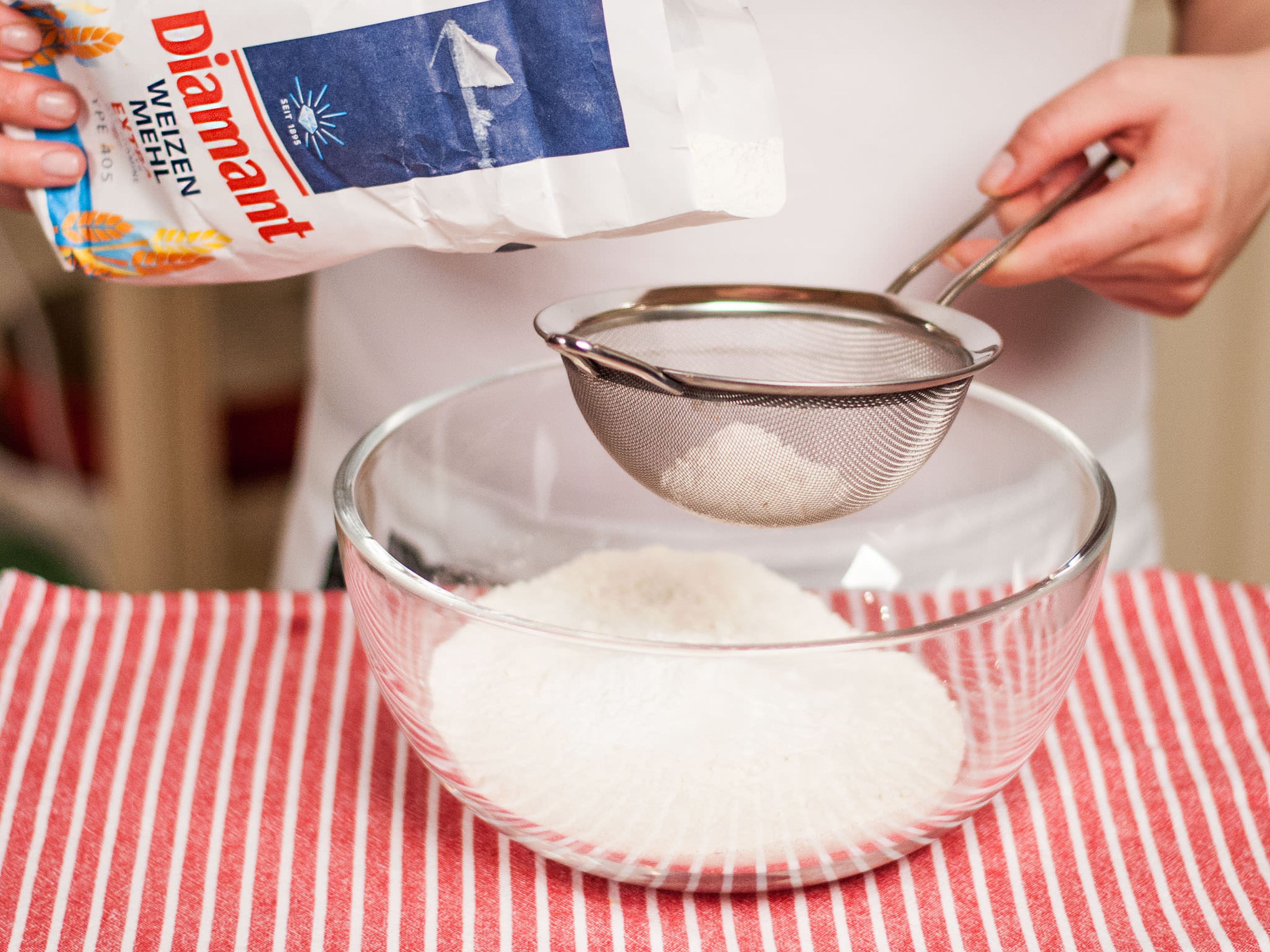 Sift flour, baking powder, and salt into separate bowl. Add to butter mixture and whisk until a smooth dough forms.
