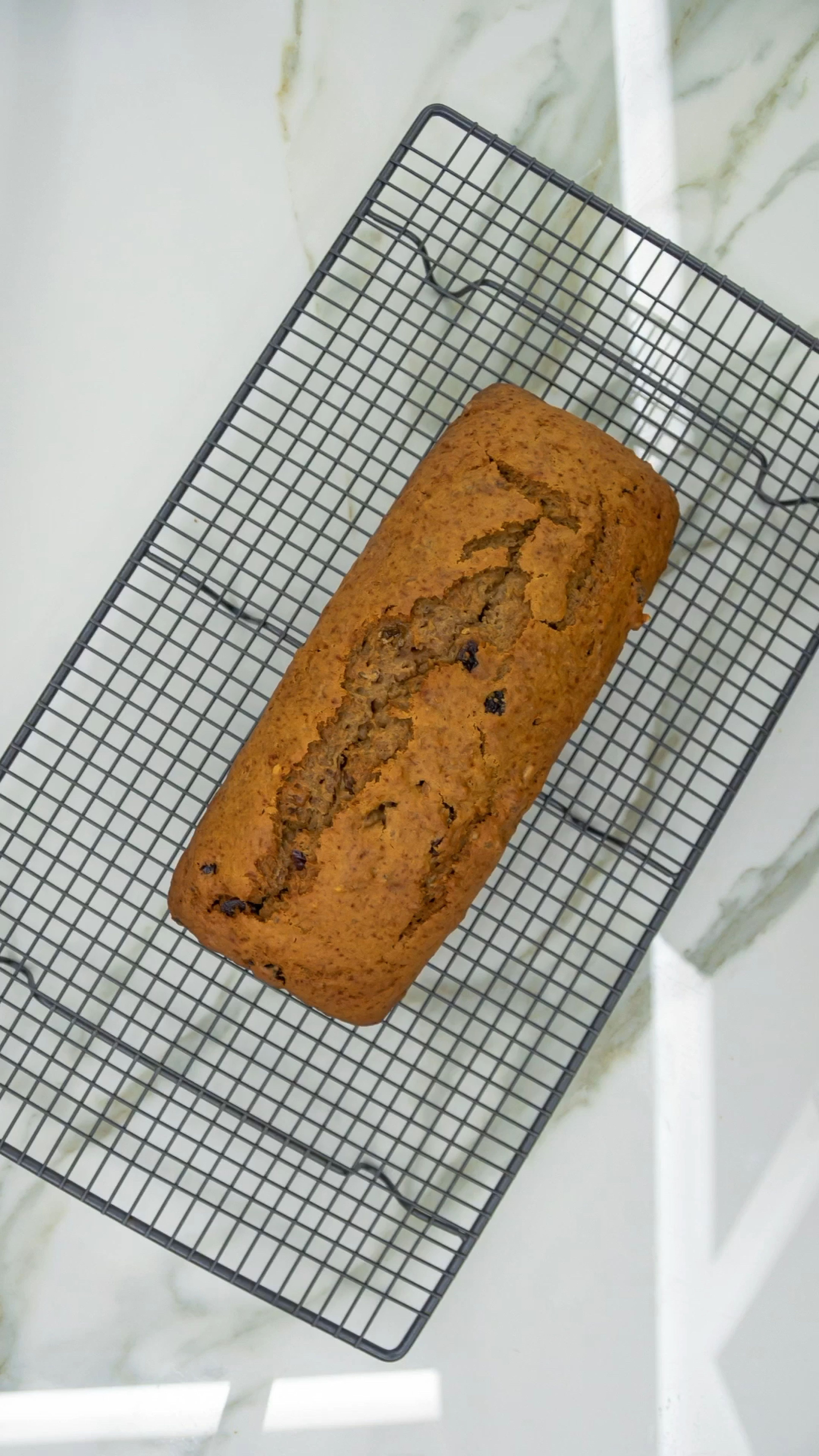 Let the pan cool on a wire rack or 15-20 minutes. Make sure no edges of the bread are stuck to the pan. Remove from pan and let fully cool on the wire rack. Enjoy!