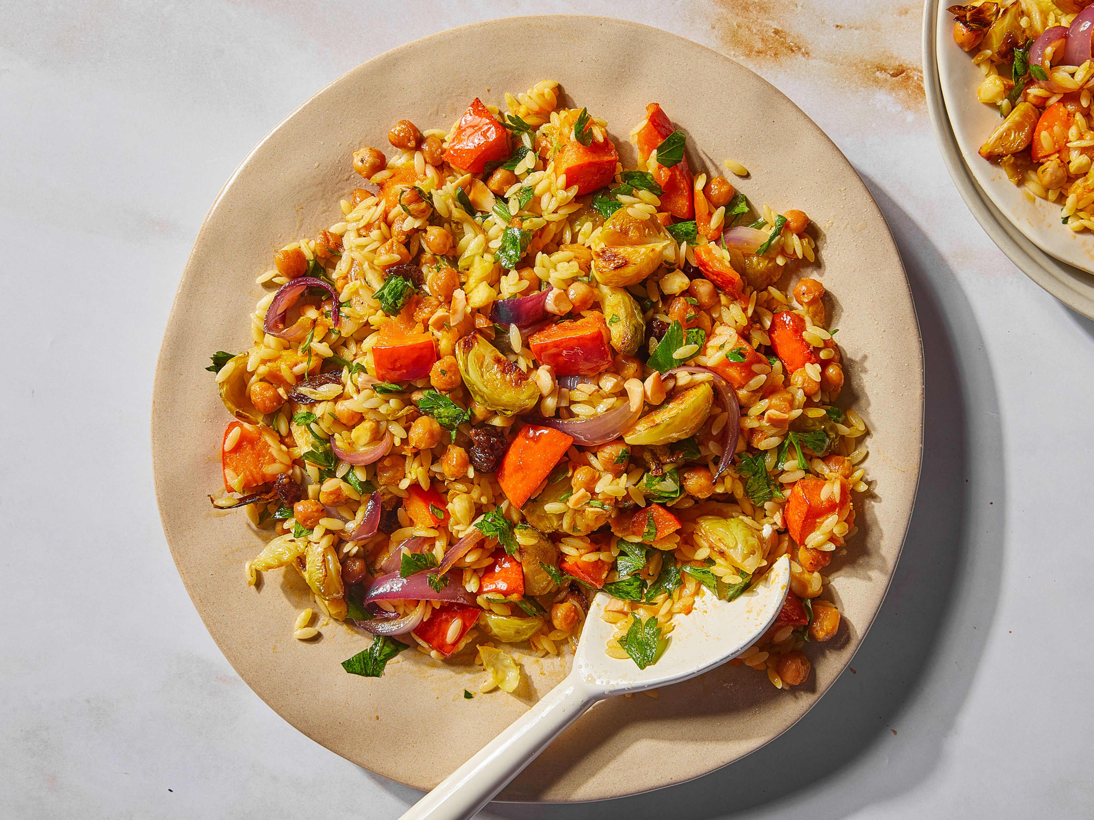 Orzo salad with harissa-roasted pumpkin and Brussels sprouts