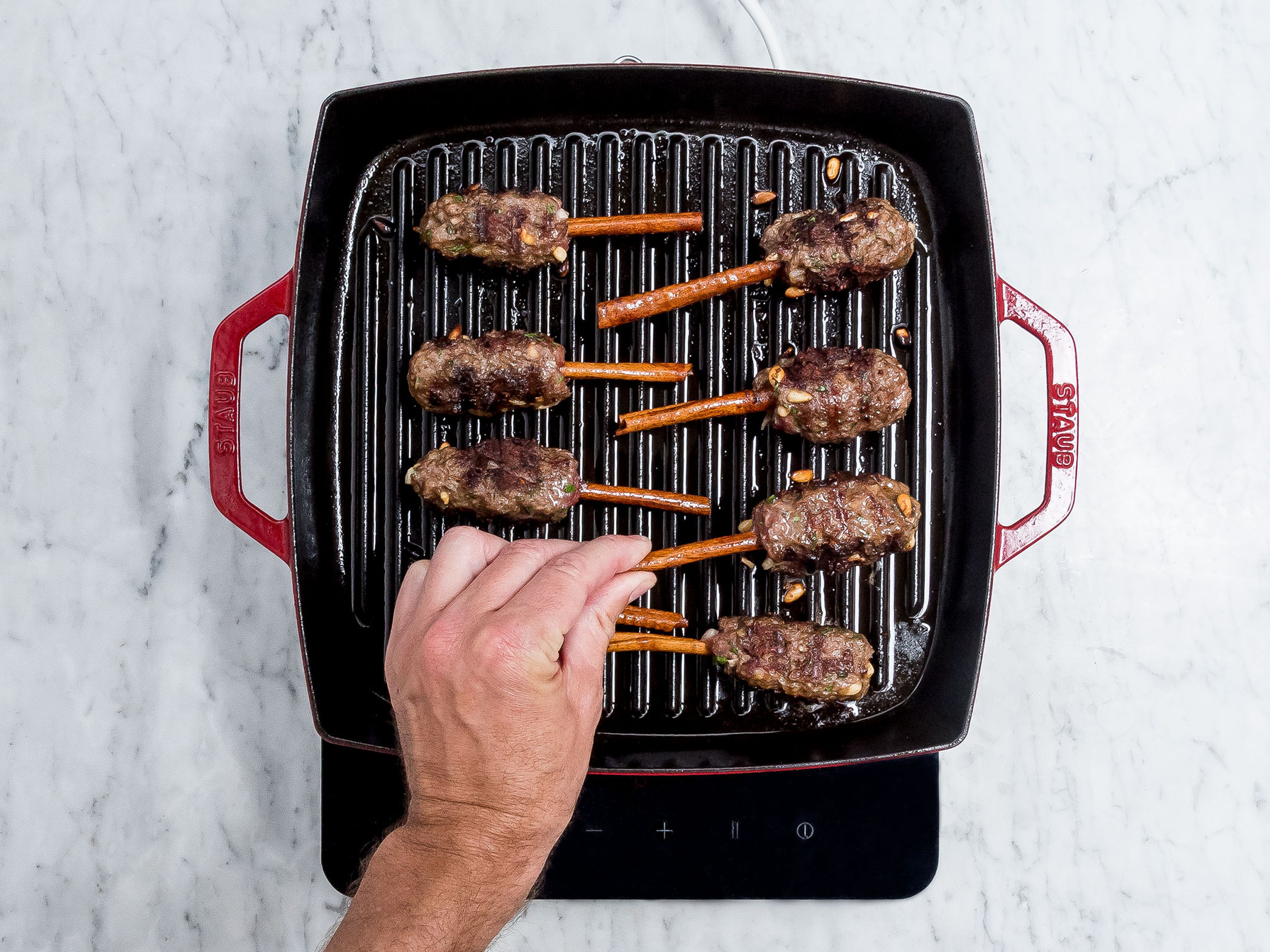 Heat some vegetable oil in a grill pan set over medium-high heat and fry kebab rolls for approx. 10 – 12 min. Serve with green tahini and enjoy!