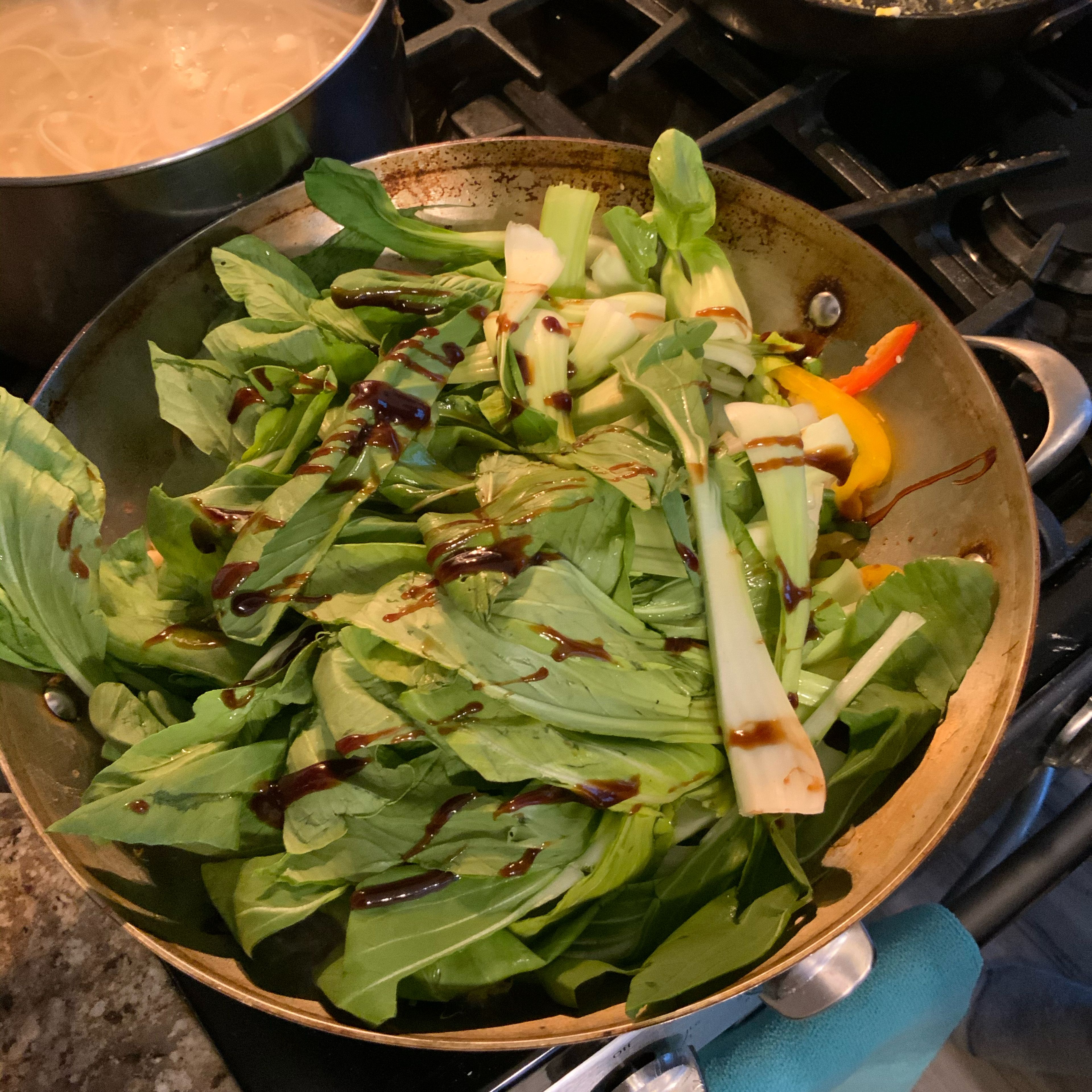 Put remaining vegetable and seasoning into the wok for approximately four minutes.