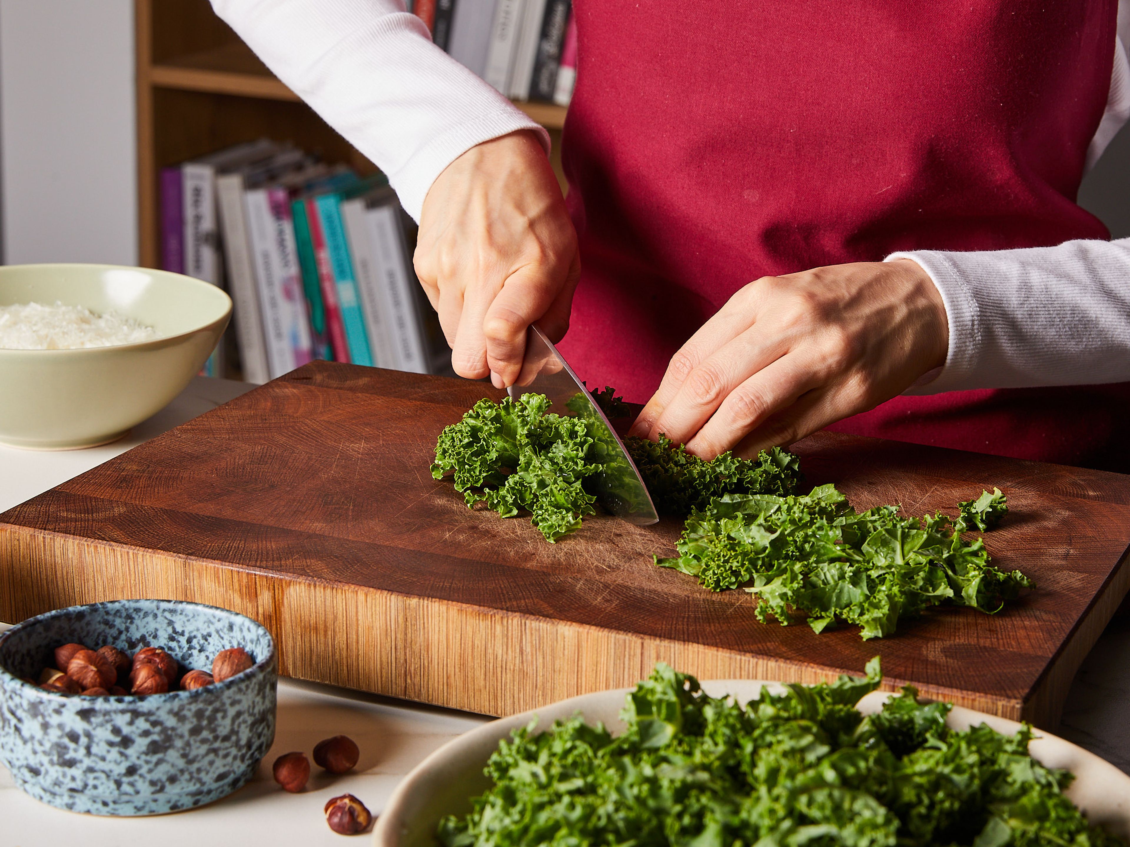 Remove kale from the stems and roughly chop. Roughly chop hazelnuts, finely grate Pecorino and set aside. Bring a large pot of water to a boil and cook linguine al dente according to package instructions. Just before draining, save a cup of pasta water.