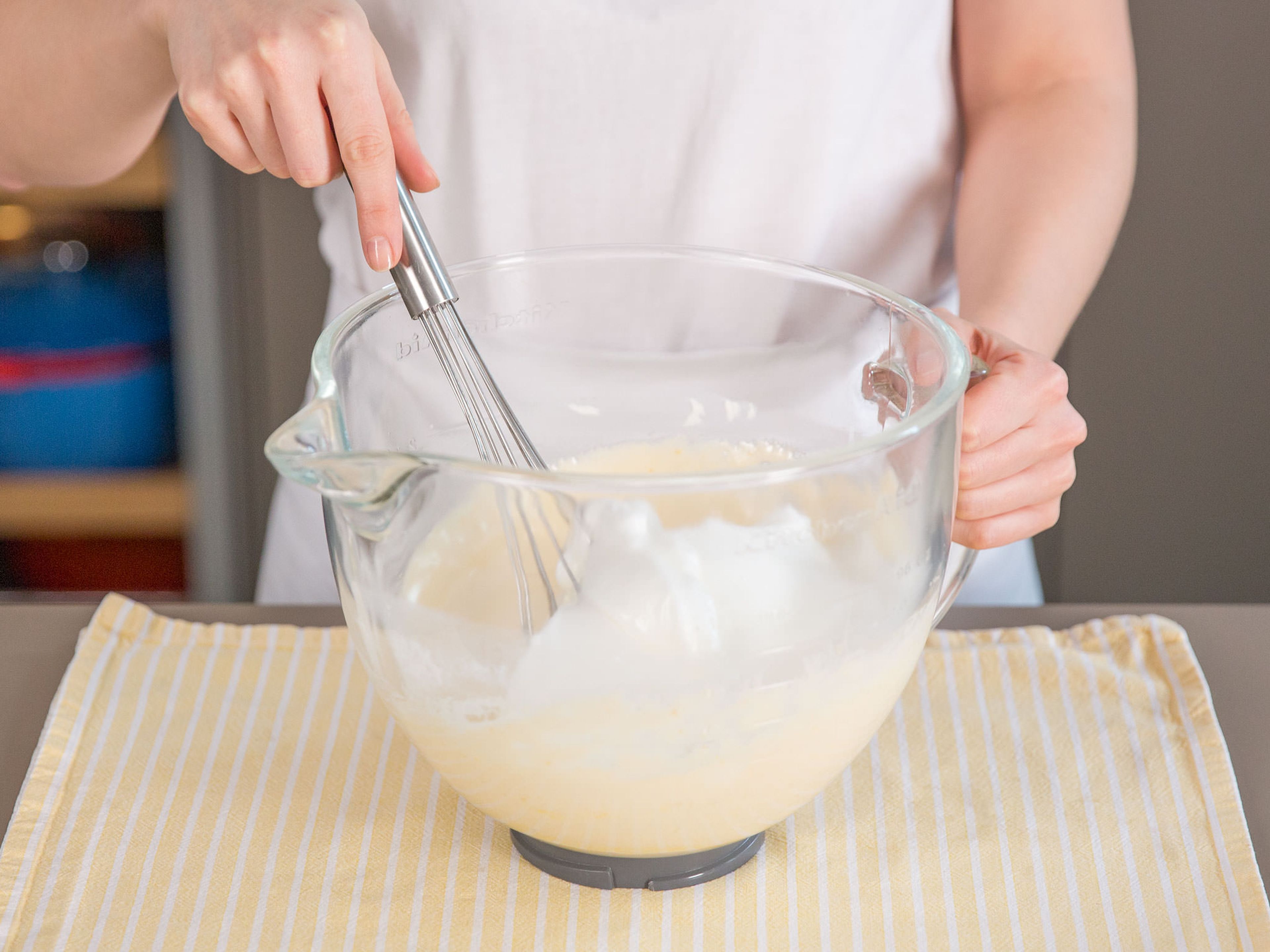 Add egg white mixture to egg yolk mixture and whisk carefully until just incorporated.