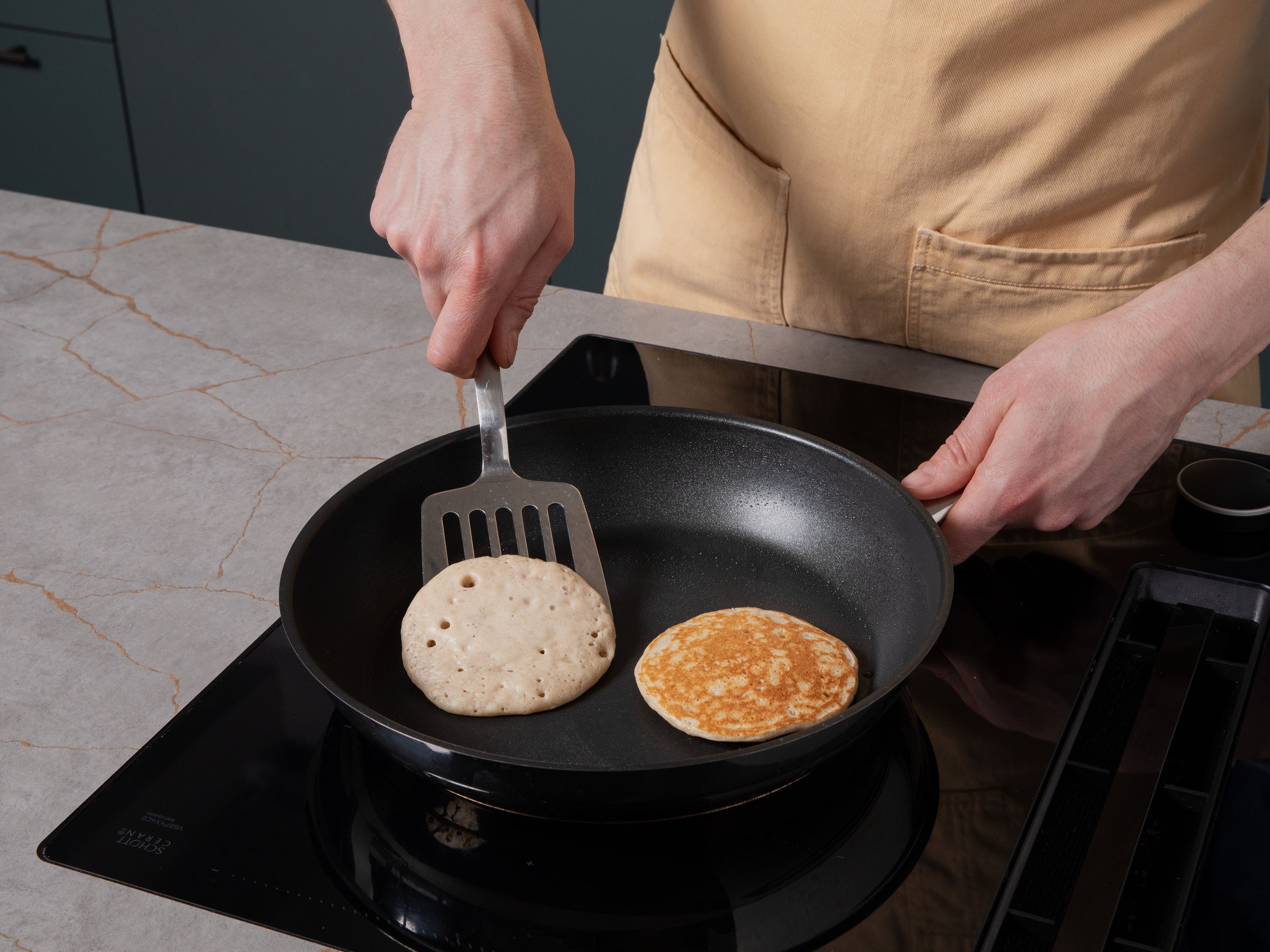 Heat a nonstick pan over medium heat and add just a little butter or oil. Use a spoon to drop small portions of the batter into the pan. Cook for approx. 2 min., until bubbles form on the surface. Flip and cook for approx. 1–2 min. more until golden brown. Repeat with the remaining batter. Stack the pancakes on a plate and serve with banana slices and maple syrup, if you like.