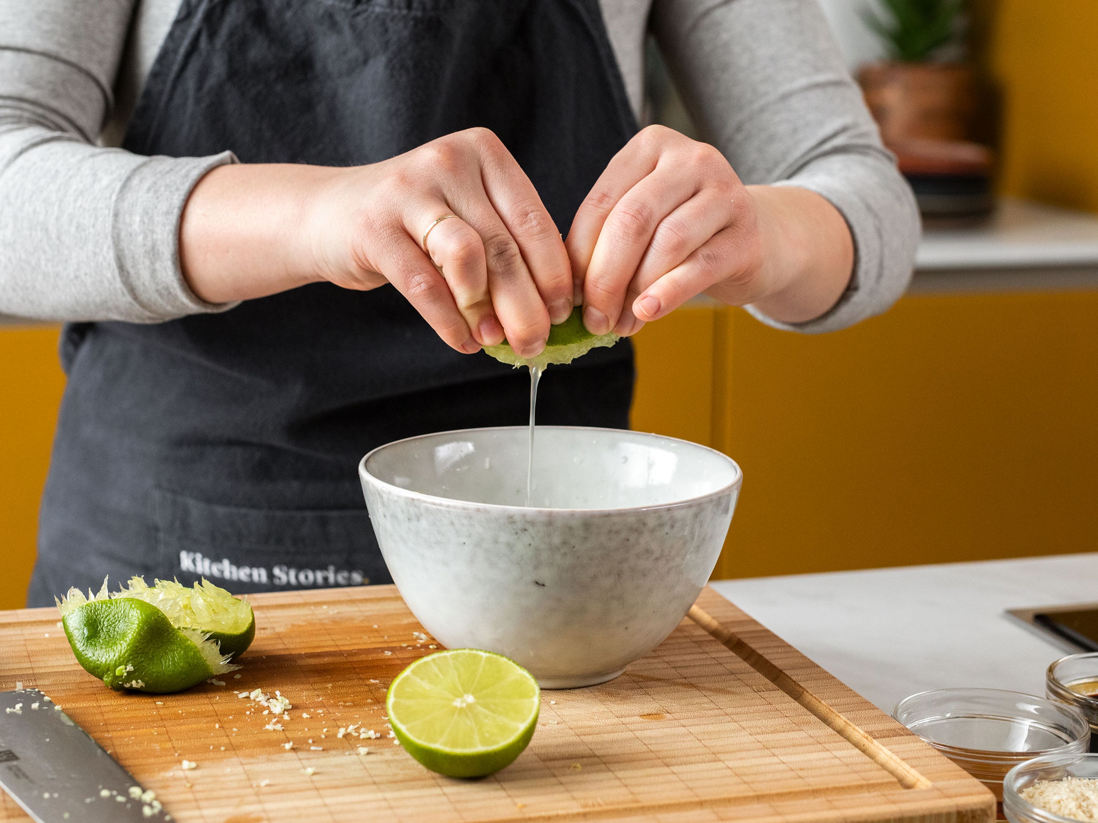 Juice the limes and finely slice chili. Tenderize lemongrass with the back of a knife, then finely slice. In a bowl, combine lemongrass, lime juice, sesame oil, soy sauce, sugar, rice vinegar, and chili. Mix well.