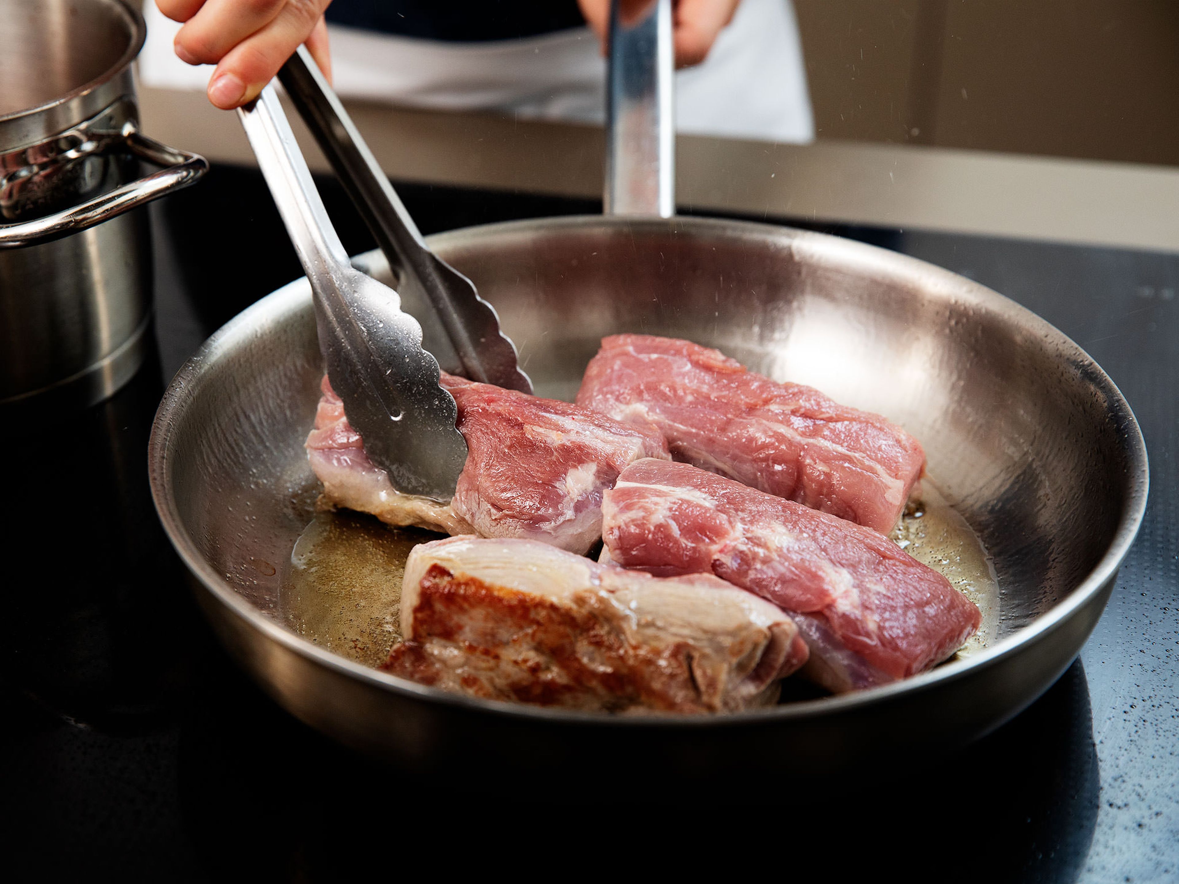 Preheat the oven to 160°C/320°F. Salt pork tenderloin on both sides. Heat vegetable oil in a frying pan set over medium-high heat and sear pork on both sides for approx. 2 – 3 min.