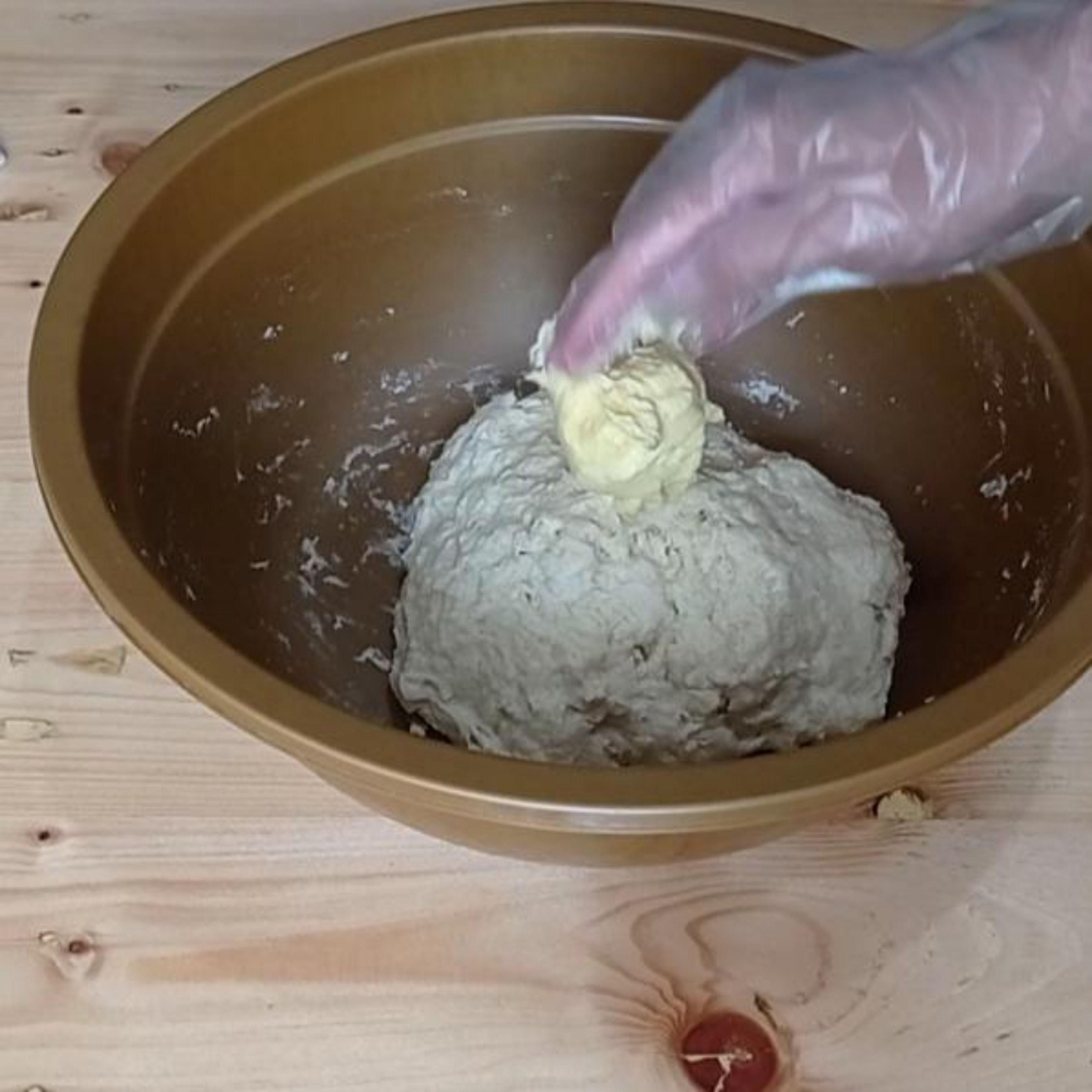 Knead the dough : Add the butter and mix well with your hand. Then transfer the dough on the silicone mat. Knead the dough until smooth and elastic.