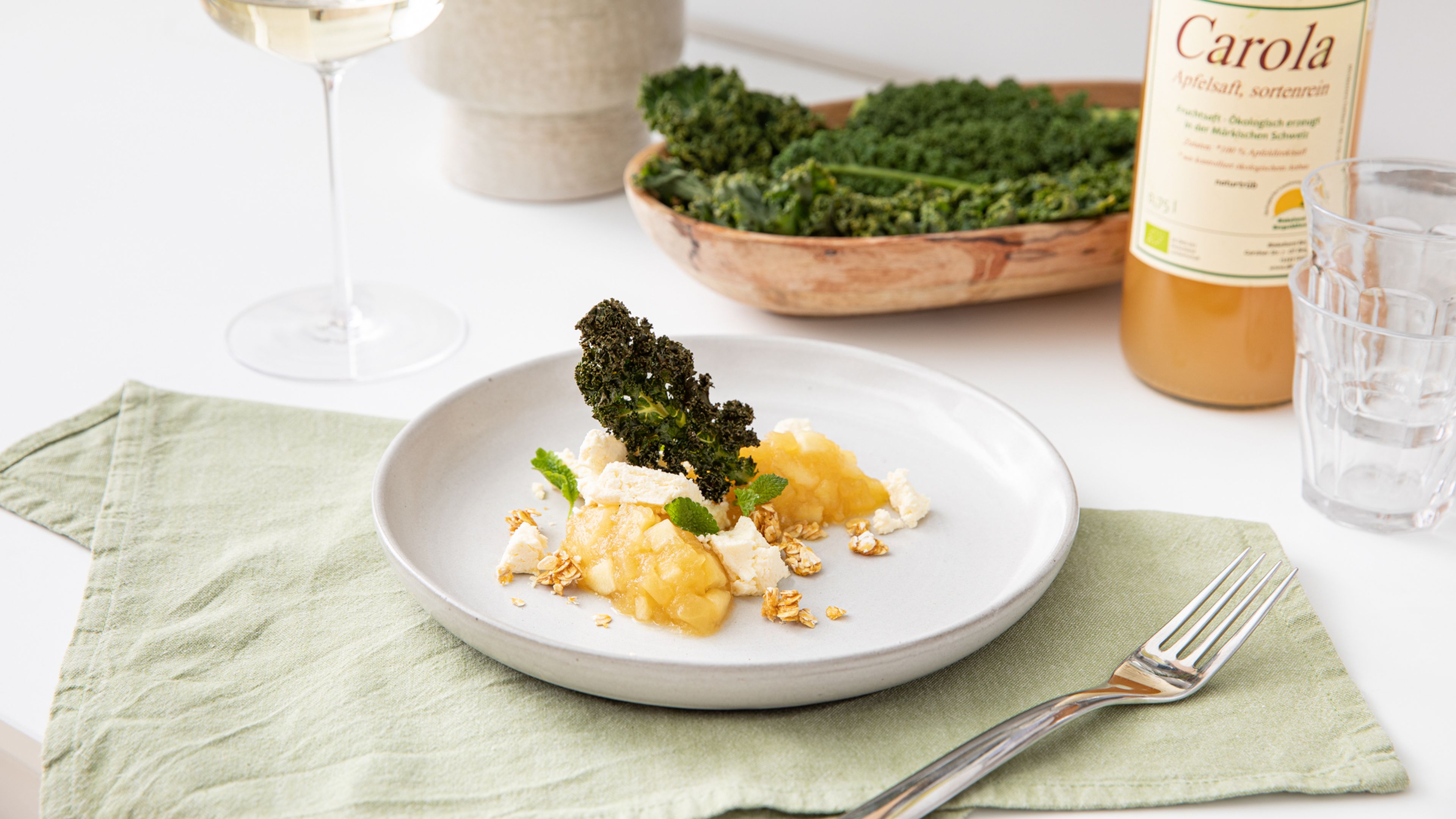 Apple compote with oatmeal crunch, cream cheese, and kale chips