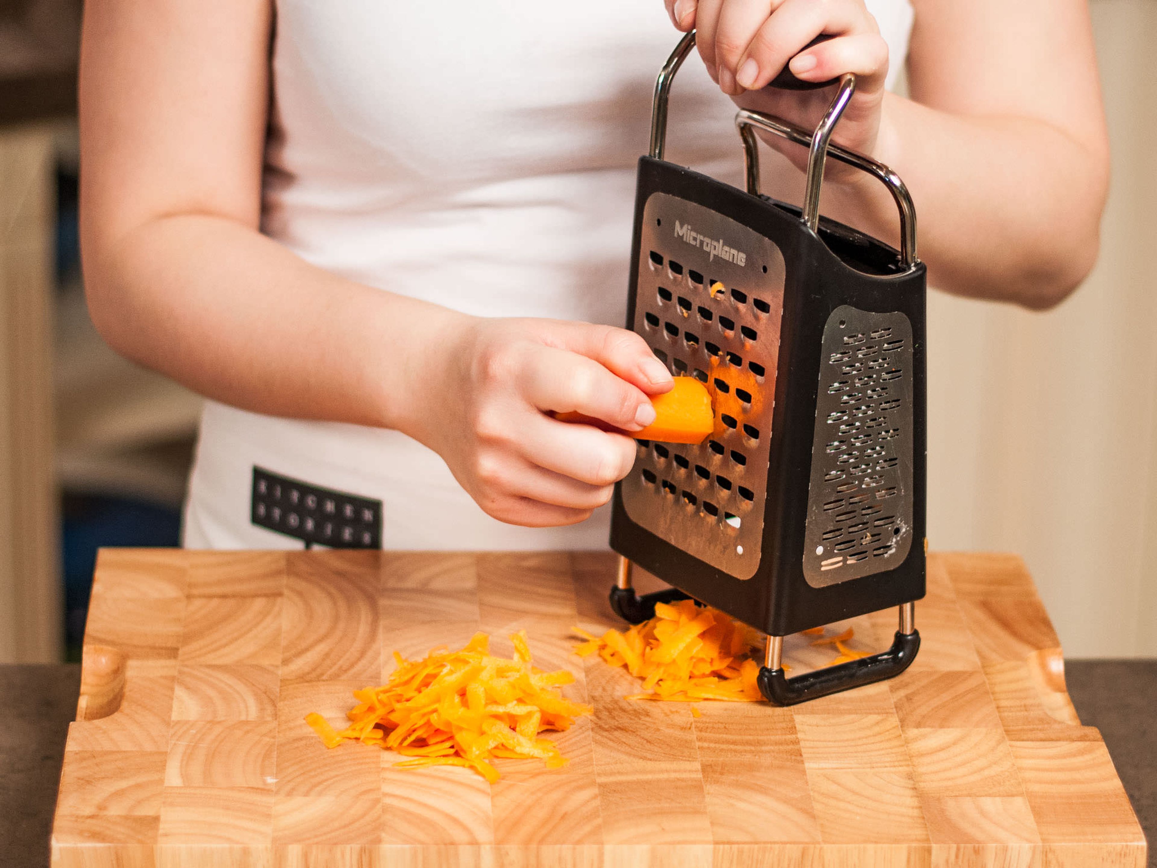 Preheat oven to 180°C/355°F. Peel and finely grate carrots.