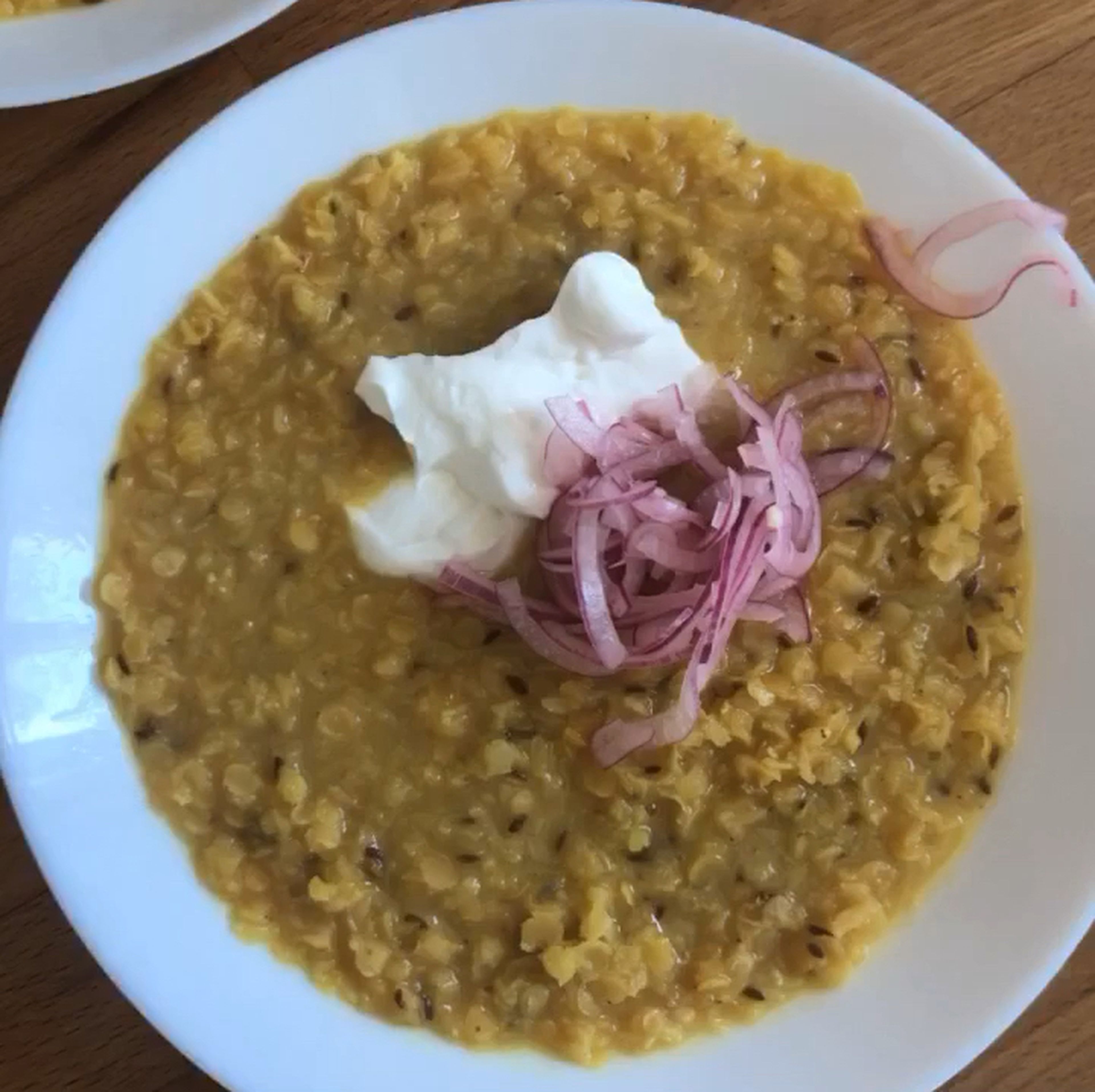 Serve the dal with yogurt and the pickled onions. Enjoy!
