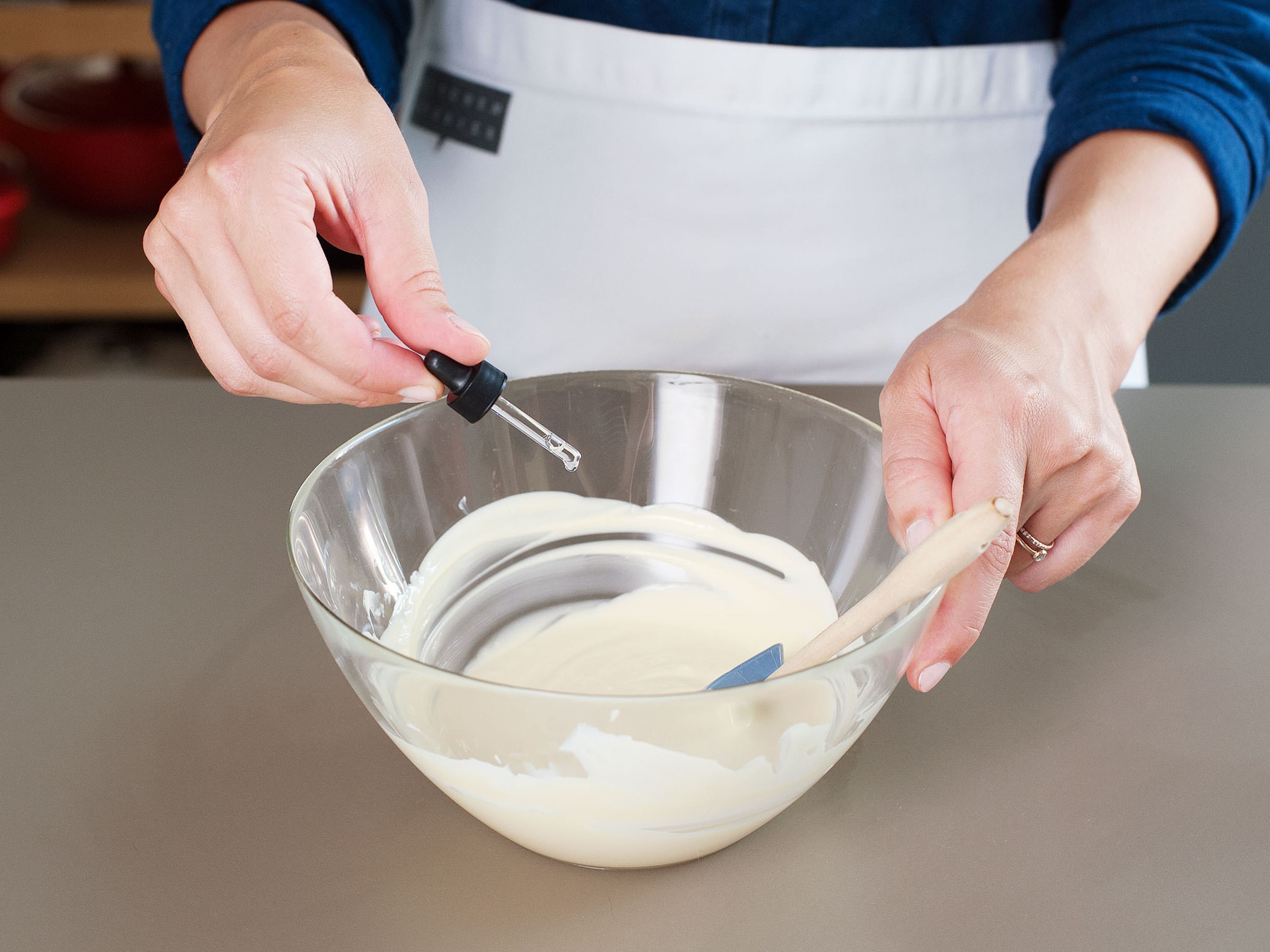 In a clean heatproof bowl, melt white chocolate over the saucepan of simmering water.  Remove from heat and stir in peppermint extract.