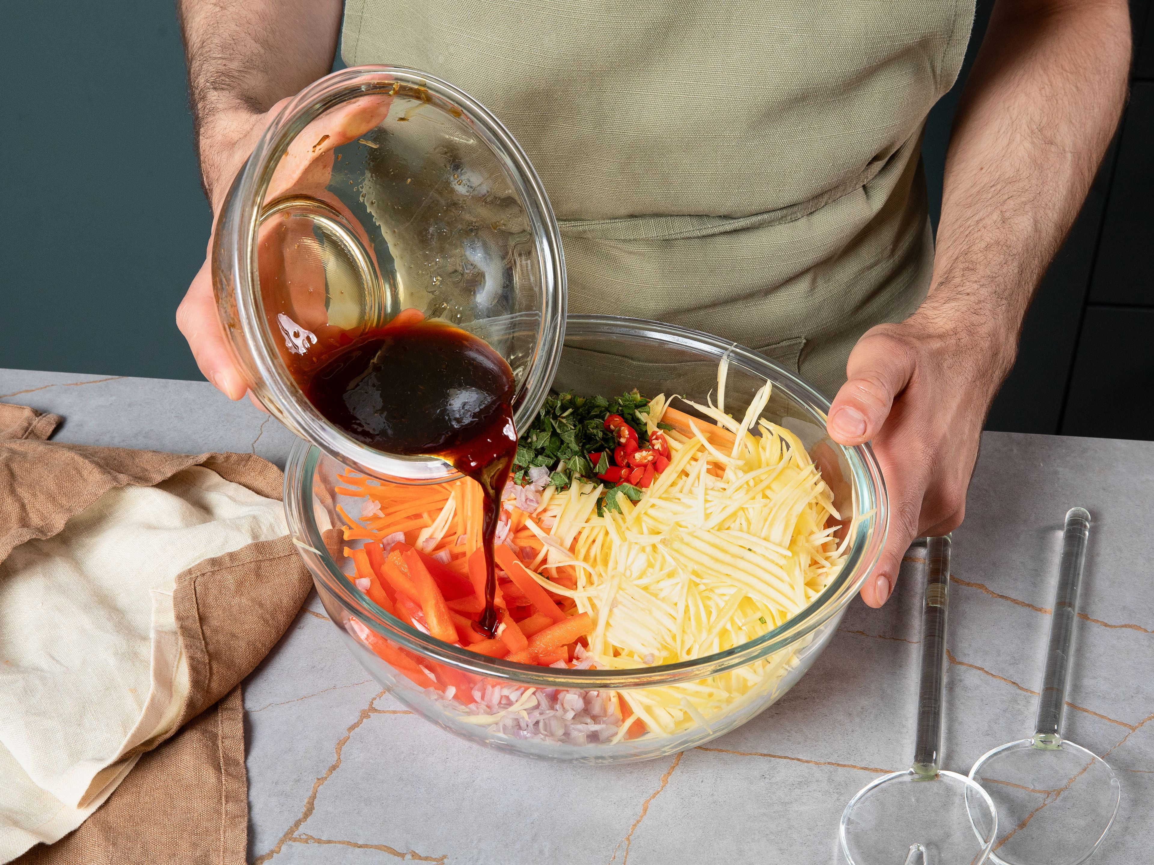 Pour dressing over the bowl with vegetables. Toss the salad together. Serve with roasted peanuts on top.