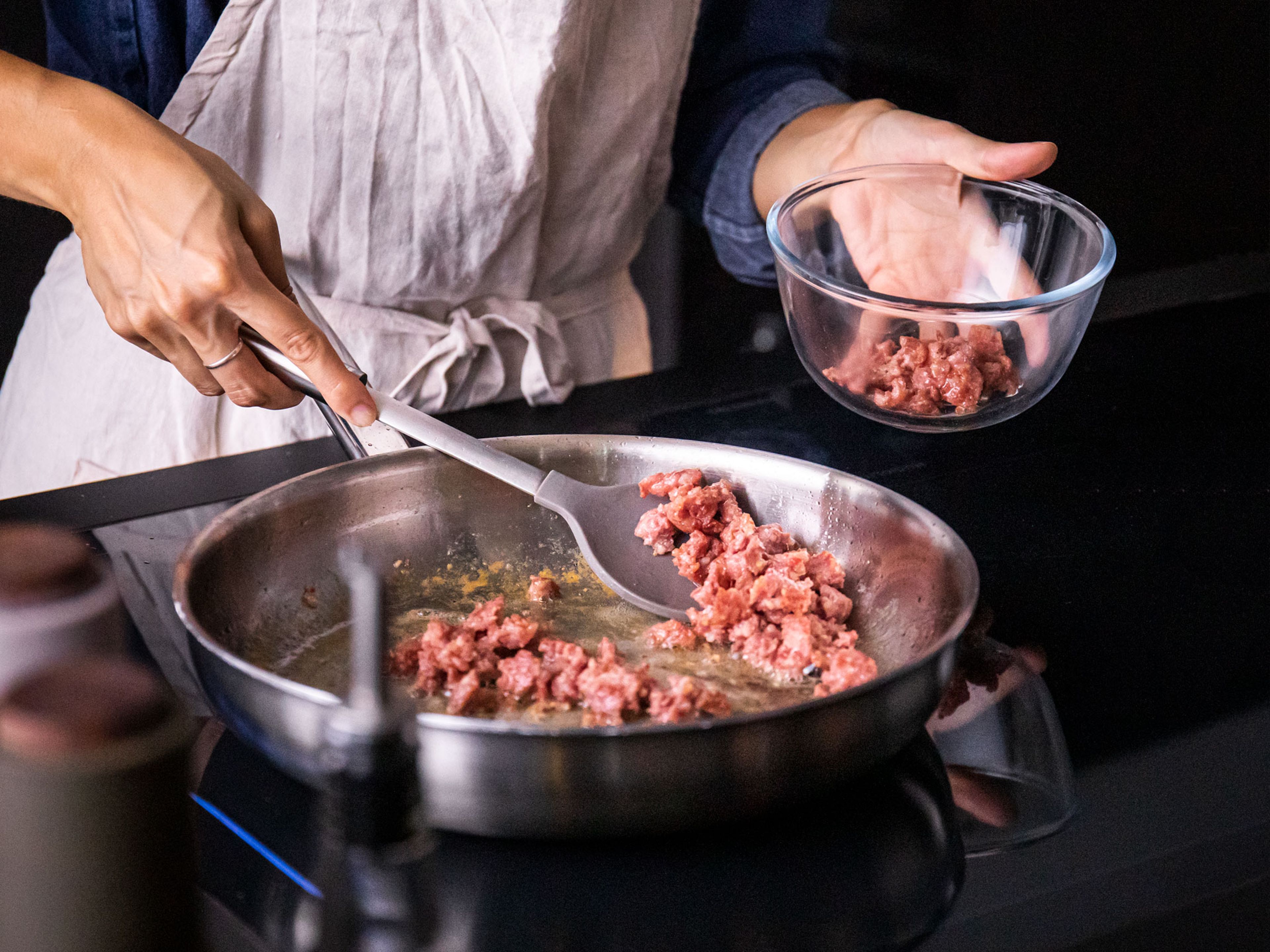 Set a large frying pan over medium-high heat. Remove sausage from the casing (if necessary) and brown it in the frying pan, breaking it up with a cooking spoon. Season with salt and pepper. Once cooked through and a bit crisp, remove and set aside. Drain any excess fat if needed.