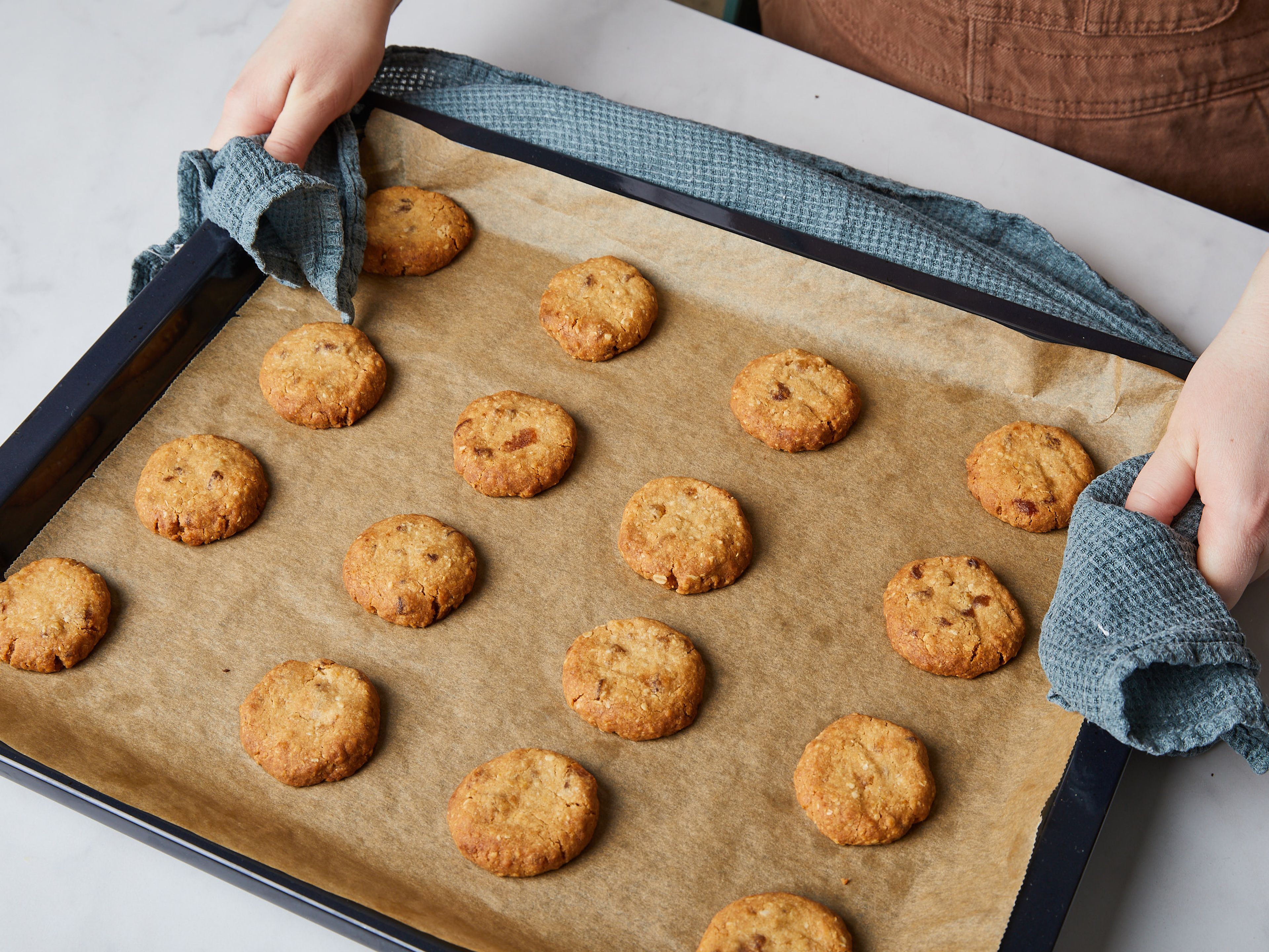 Transfer the cookies to the preheated oven and bake for approx. 15 – 16 min., or until pale golden. Remove from the oven, and let cool for approx. 20 – 30 min. Serve immediately or store in an airtight container. Enjoy!