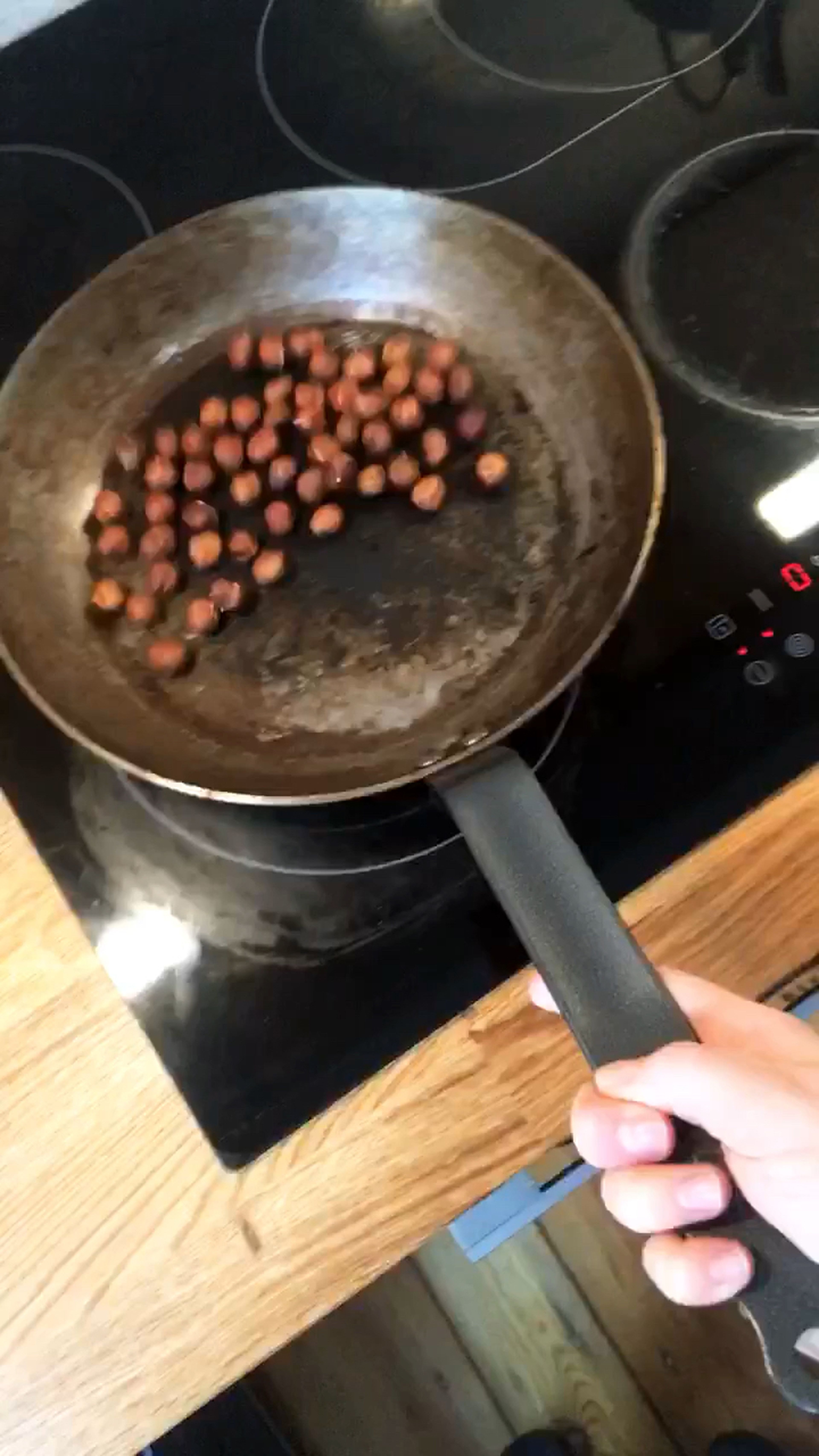 Toast the hazelnuts in a dry frying pan.