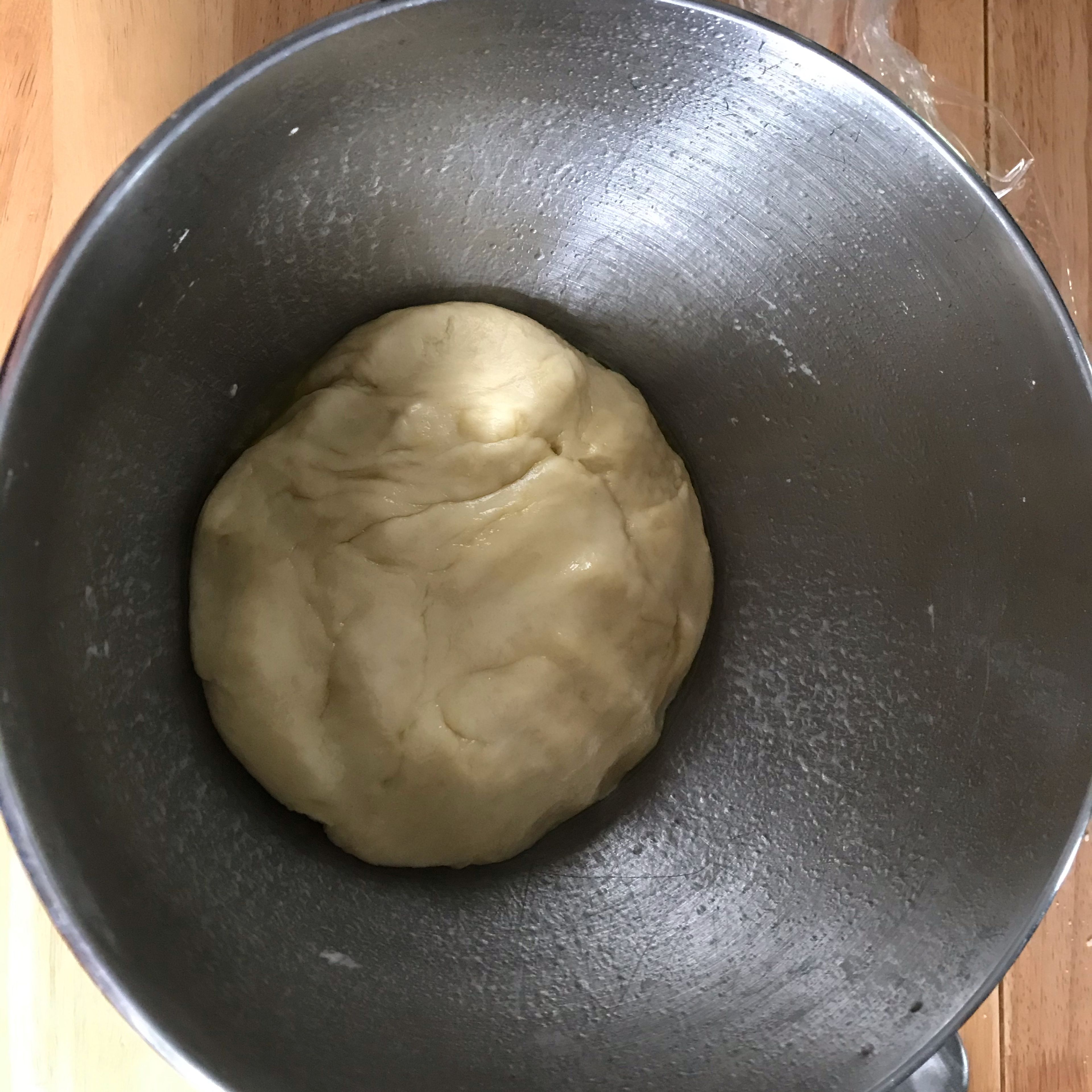 Take your dough out of the bowl it should be much bigger and thicker oil a sheet pan and place your dough down and roll it out. place whatever toppings you desire in top.