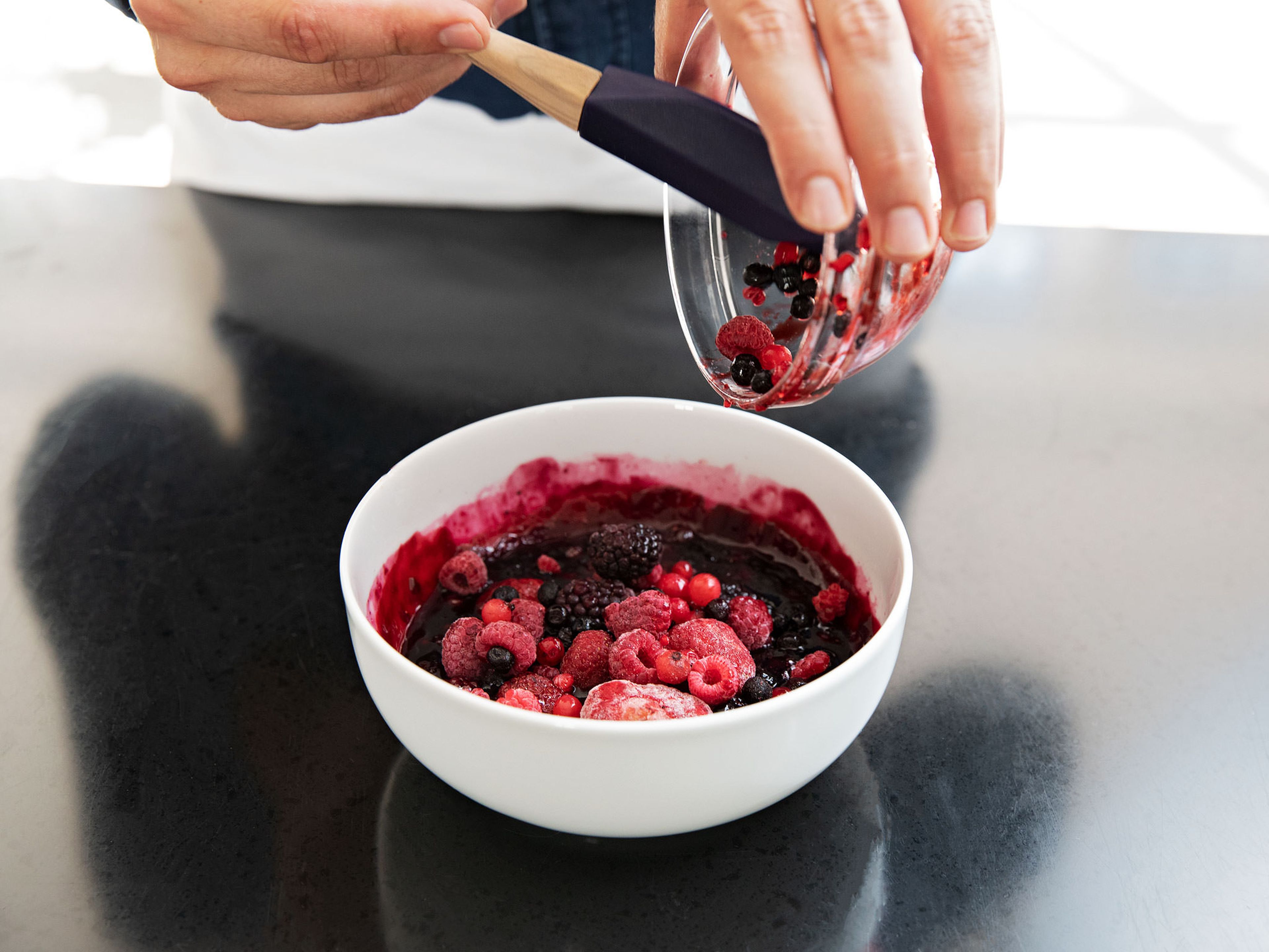 Remove both bowls, add the remaining frozen mixed berries to the berry compote, and stir until combined. Mix the porridge with berry compote. Enjoy!