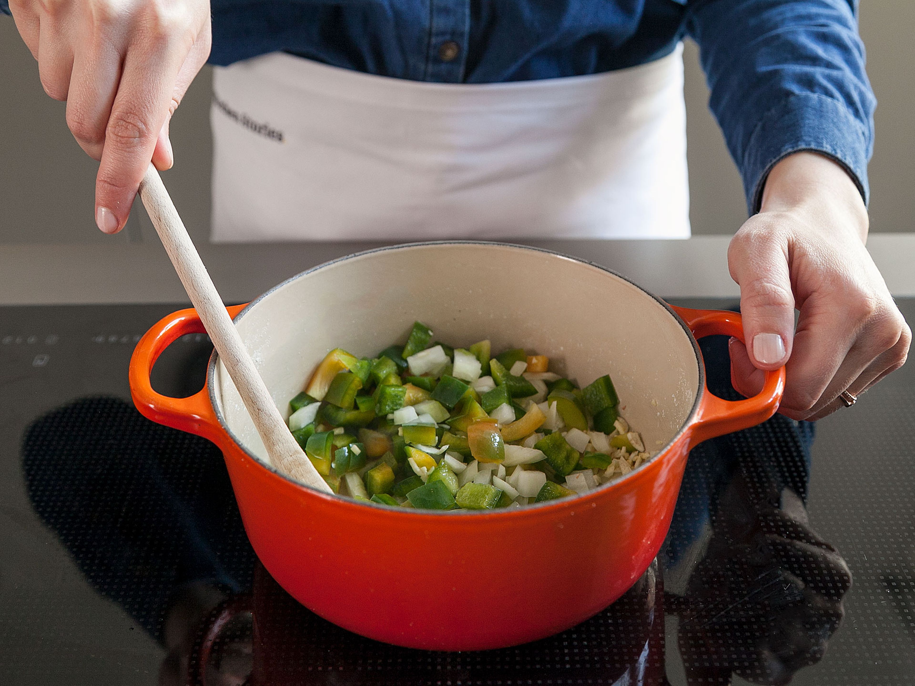 Heat oil in the same saucepan over medium-high heat. Add chopped onion, bell pepper, and garlic. Sauté, stirring occasionally, for approx. 3 – 4 min., or until tender.