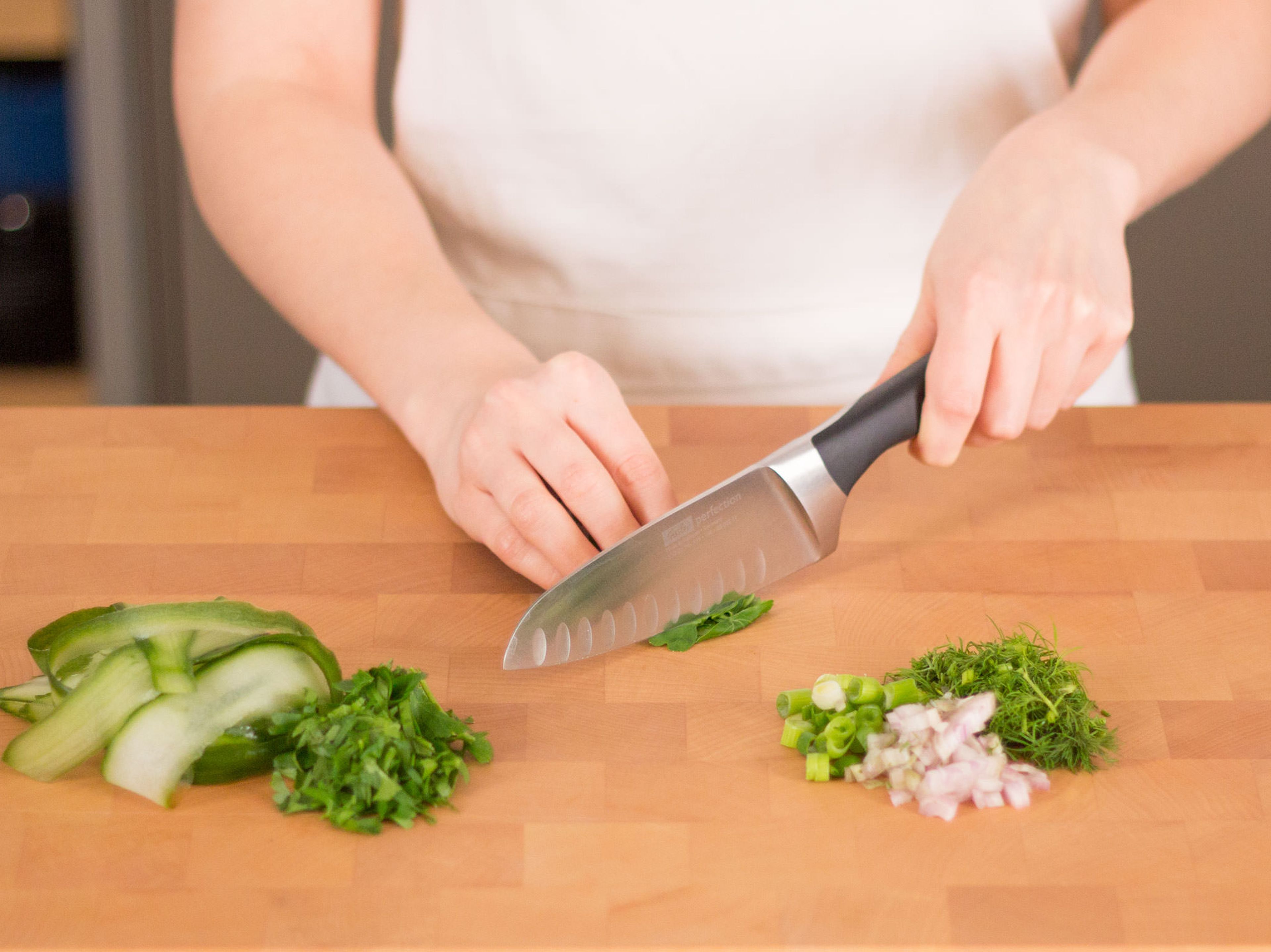 Use vegetable peeler to cut cucumber into tagliatelle-like strips.