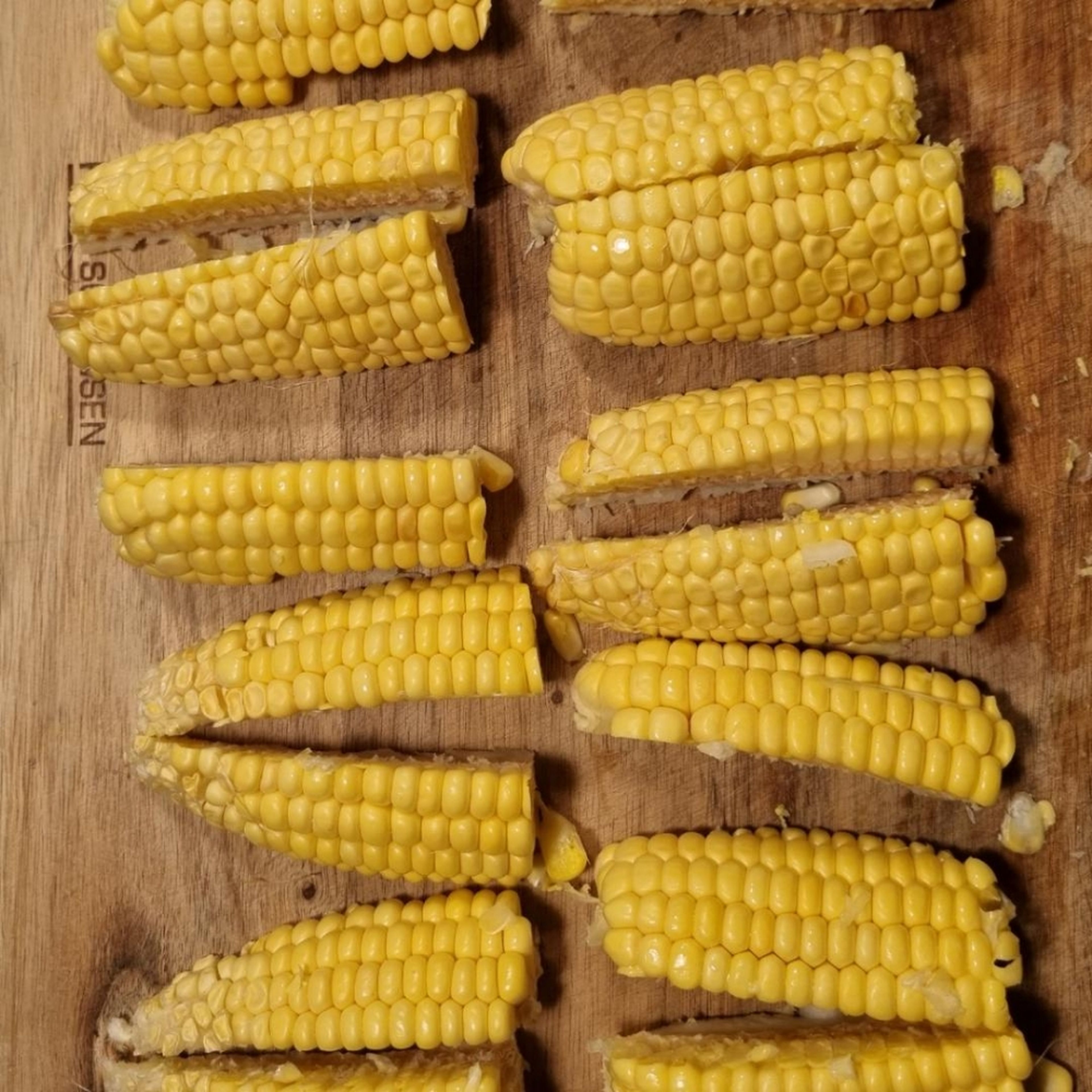 Chop the corn into quarters. Best to cut them in half and then into quarters.