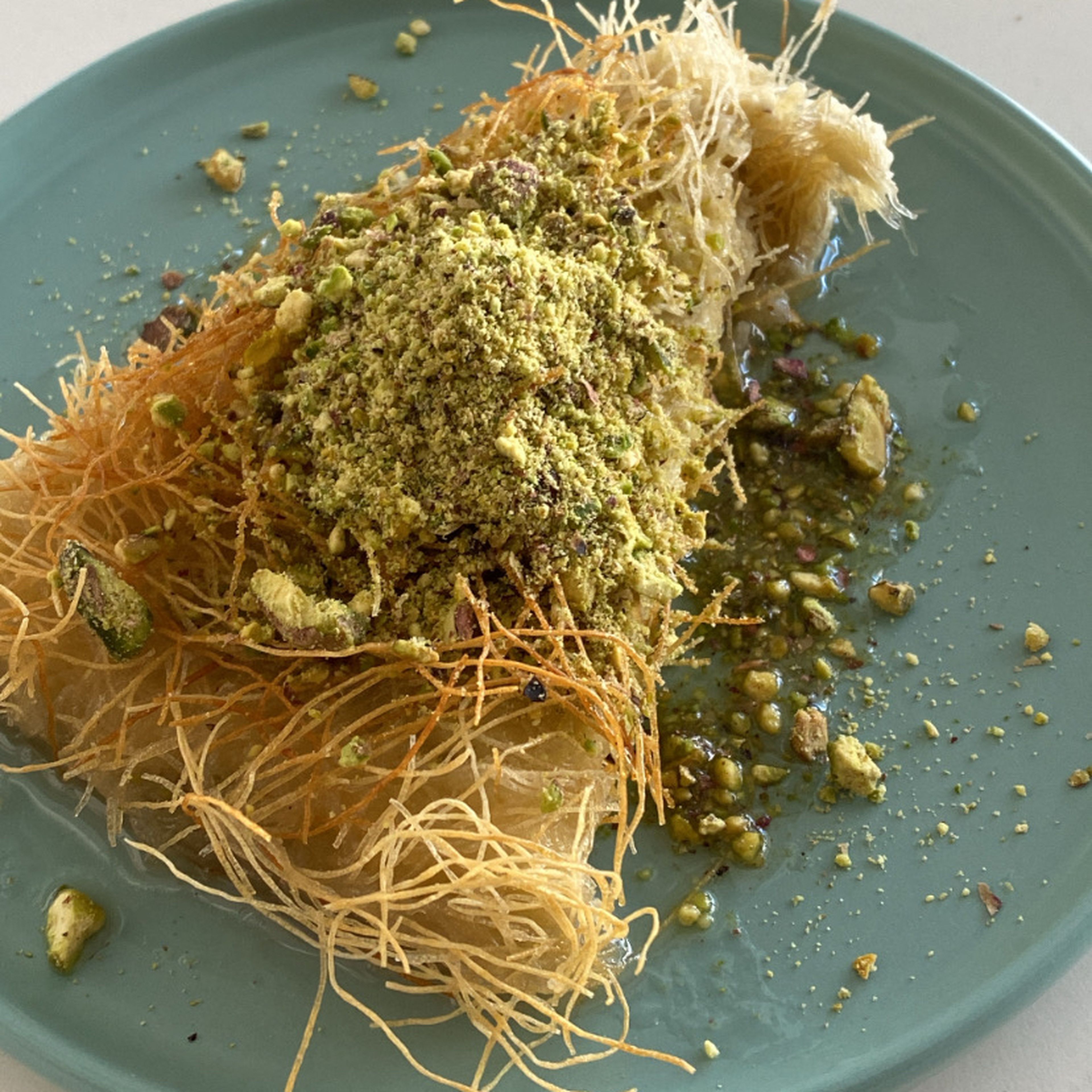 Slice your knafeh, add some pistachios and enjoy!