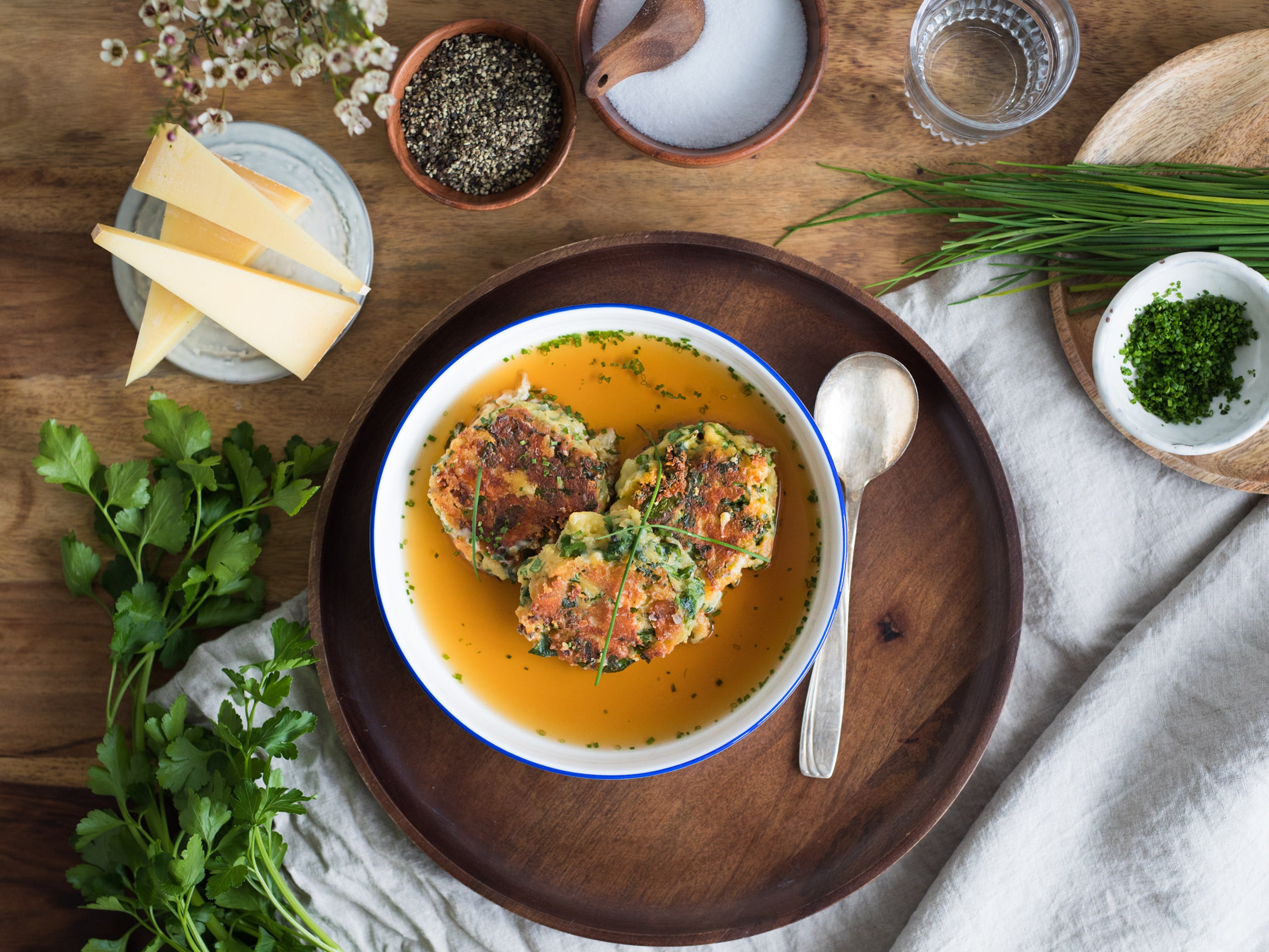 Cheesy bread dumplings in broth