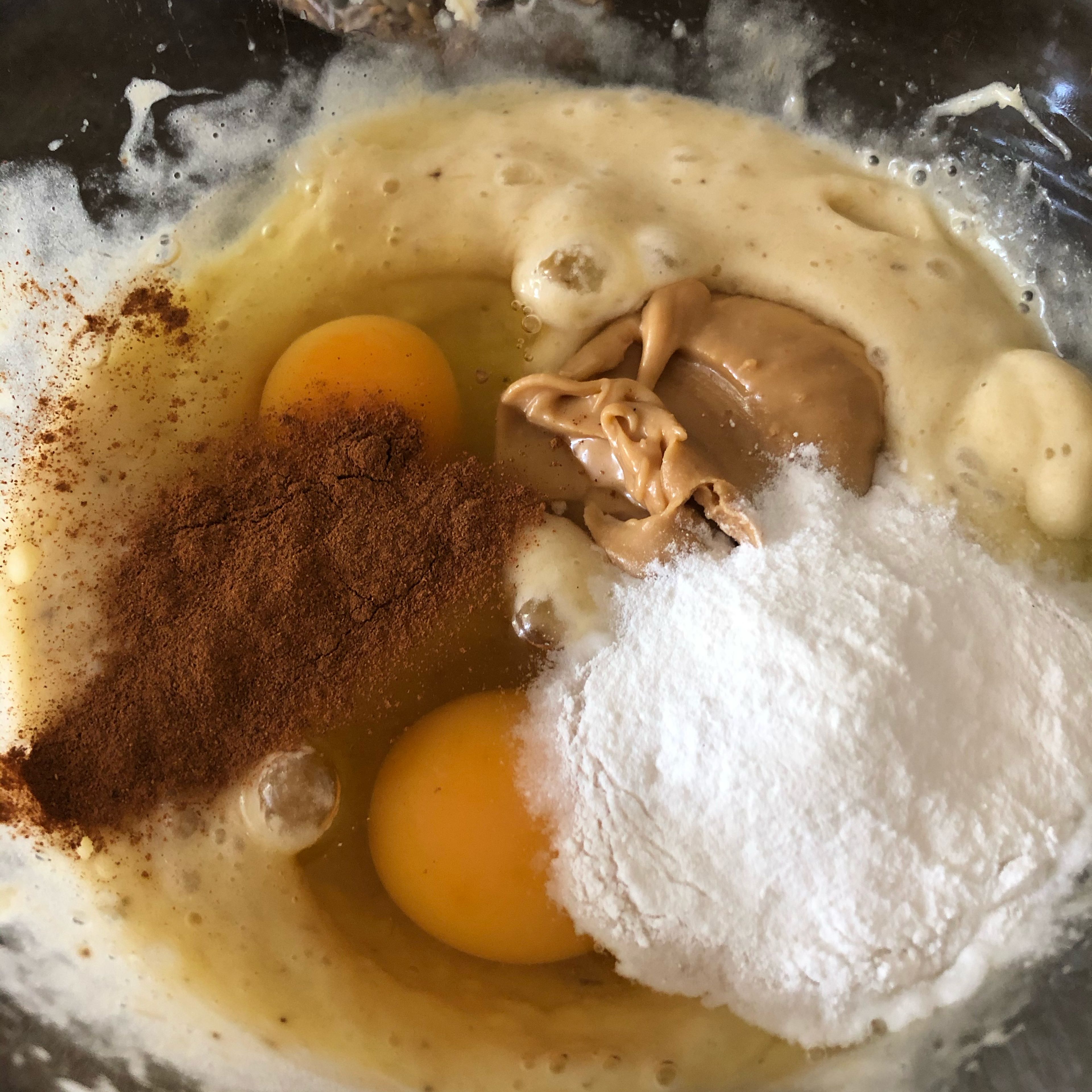 Add the eggs, ground cinnamon, peanut butter, and baking powder, then mix.