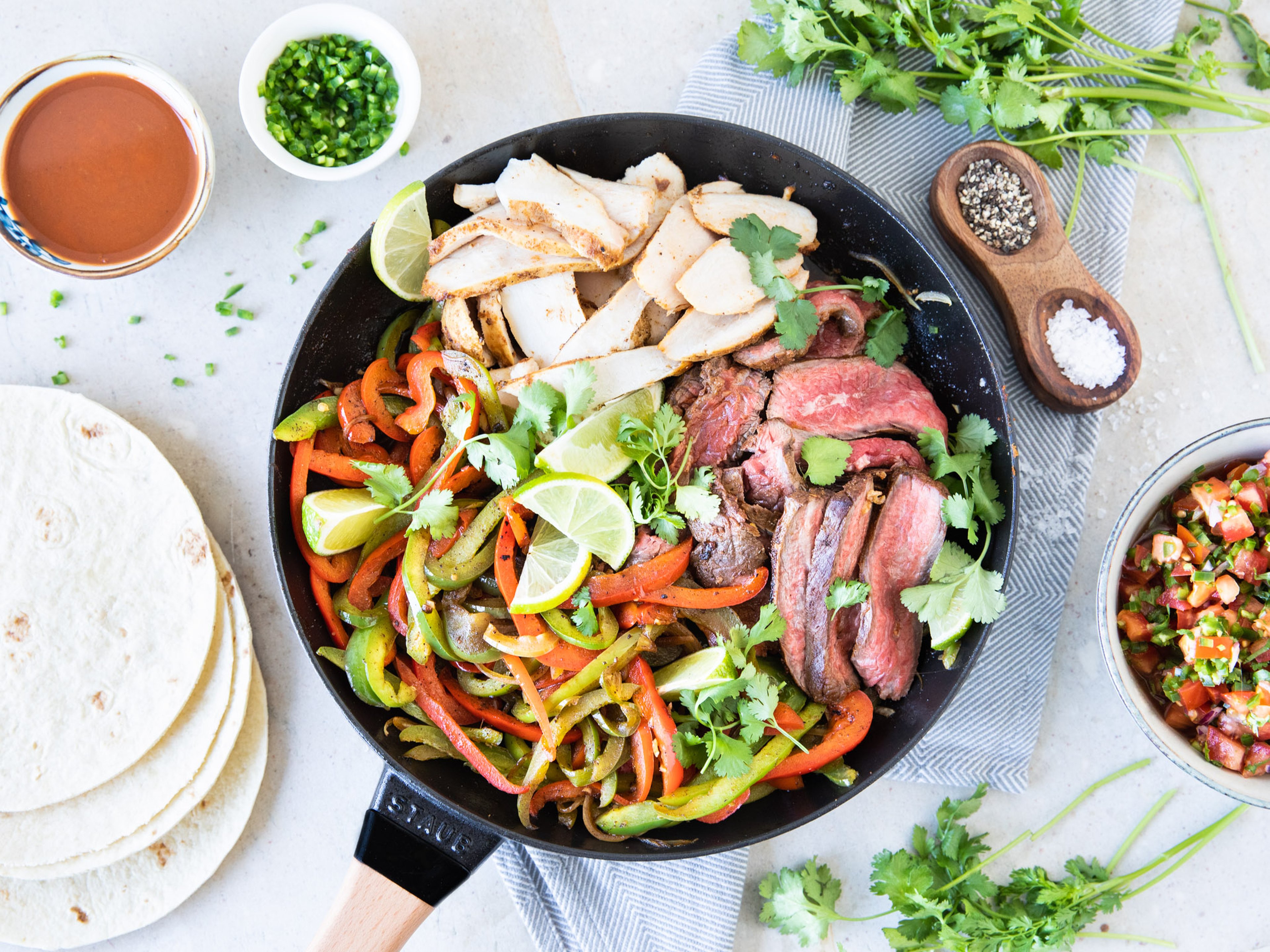 Steak and chicken fajitas with fresh salsa