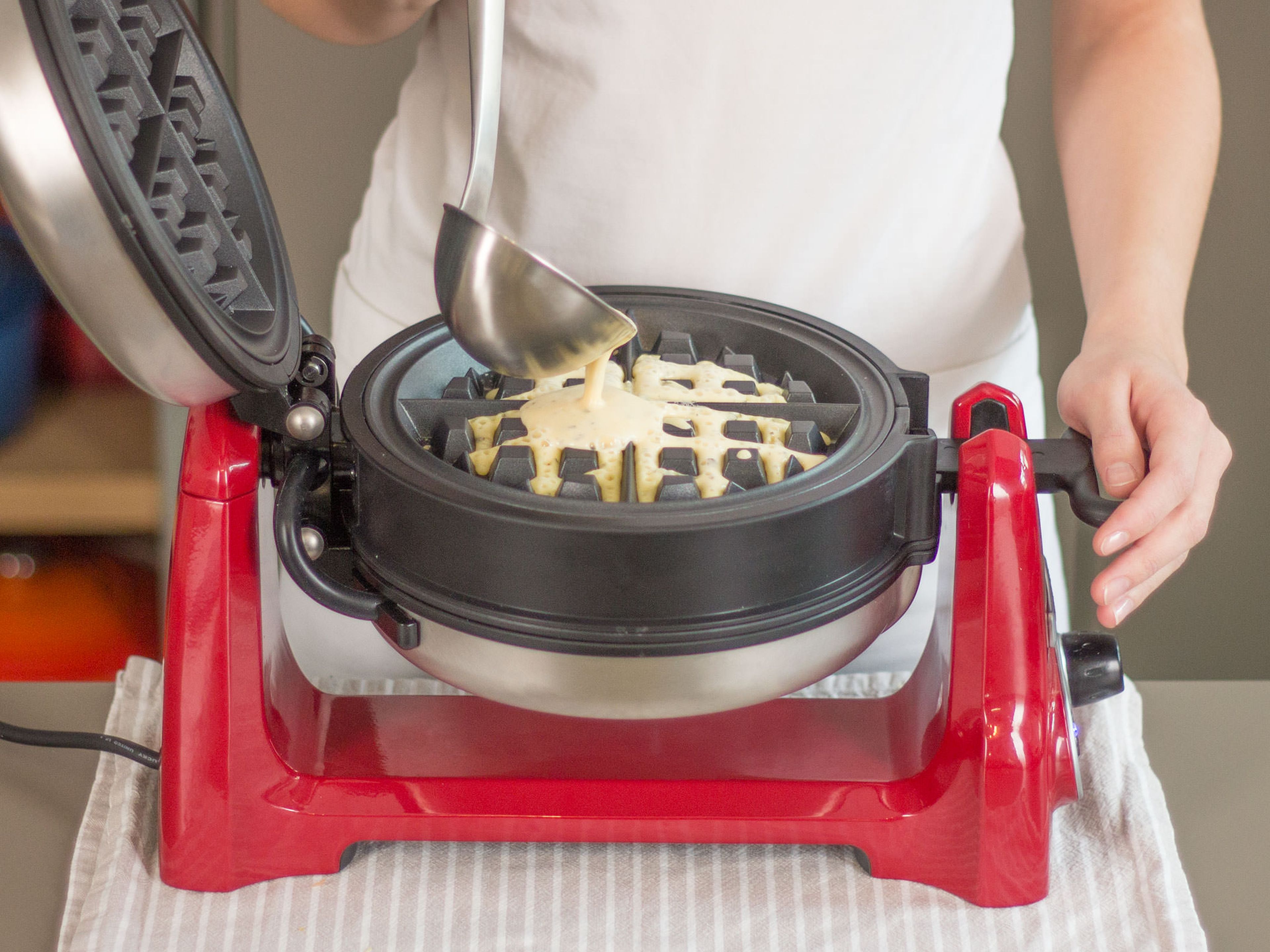 Preheat a waffle maker and grease with some butter. Pour some of the batter into waffle maker and cook for approx. 3 – 4 min. or until golden brown.
