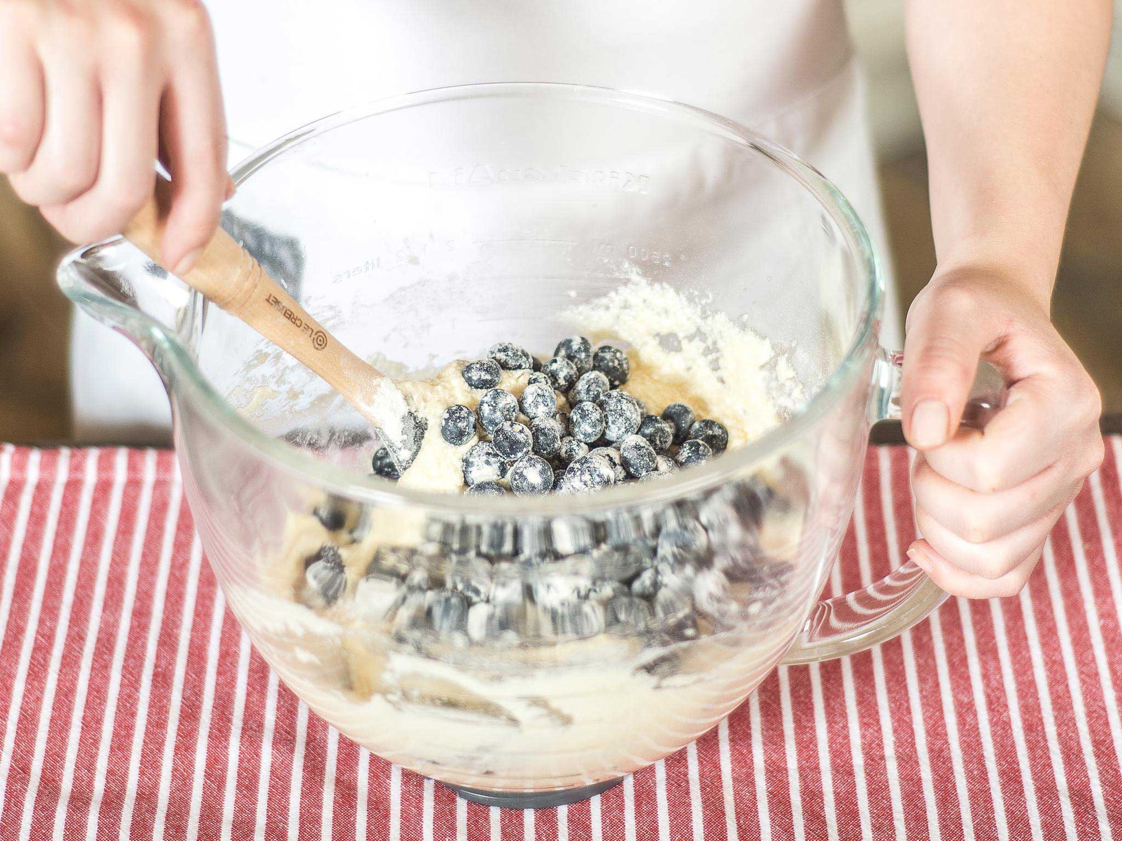 Now, carefully fold in the blueberries by hand using a rubber spatula or a wooden spoon.