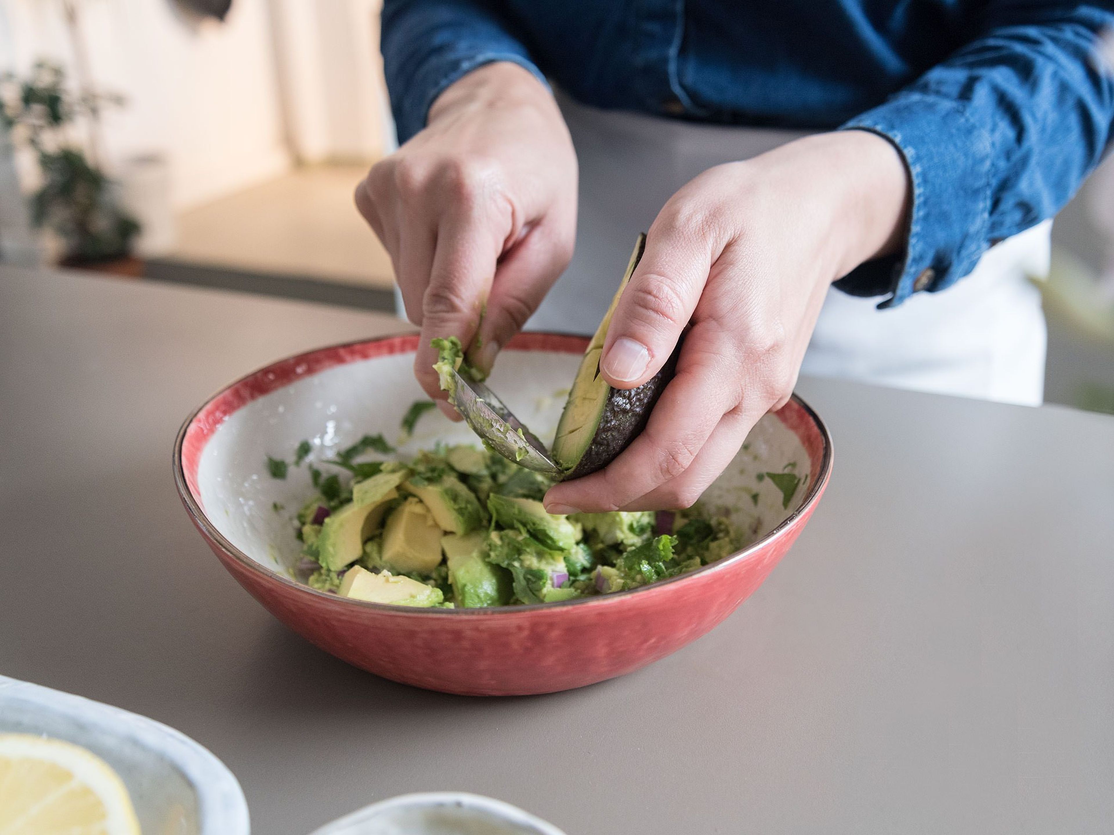 Dice the remaining avocado and fold into the guacamole along with cucumber.