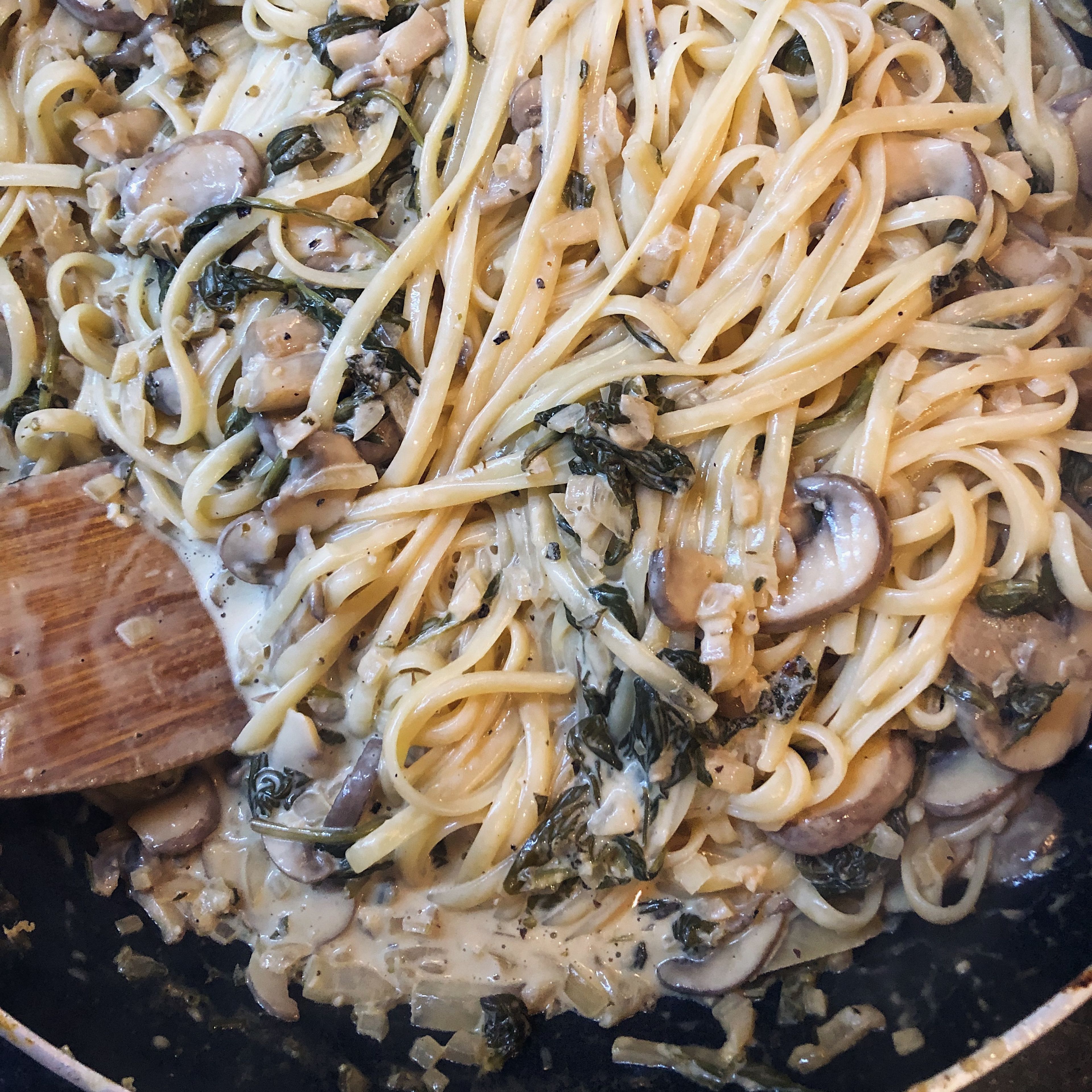 Add cooked linguine to sauce, keep on low heat for 5 minutes and toast pine nuts in separate frying pan for 2 minutes.