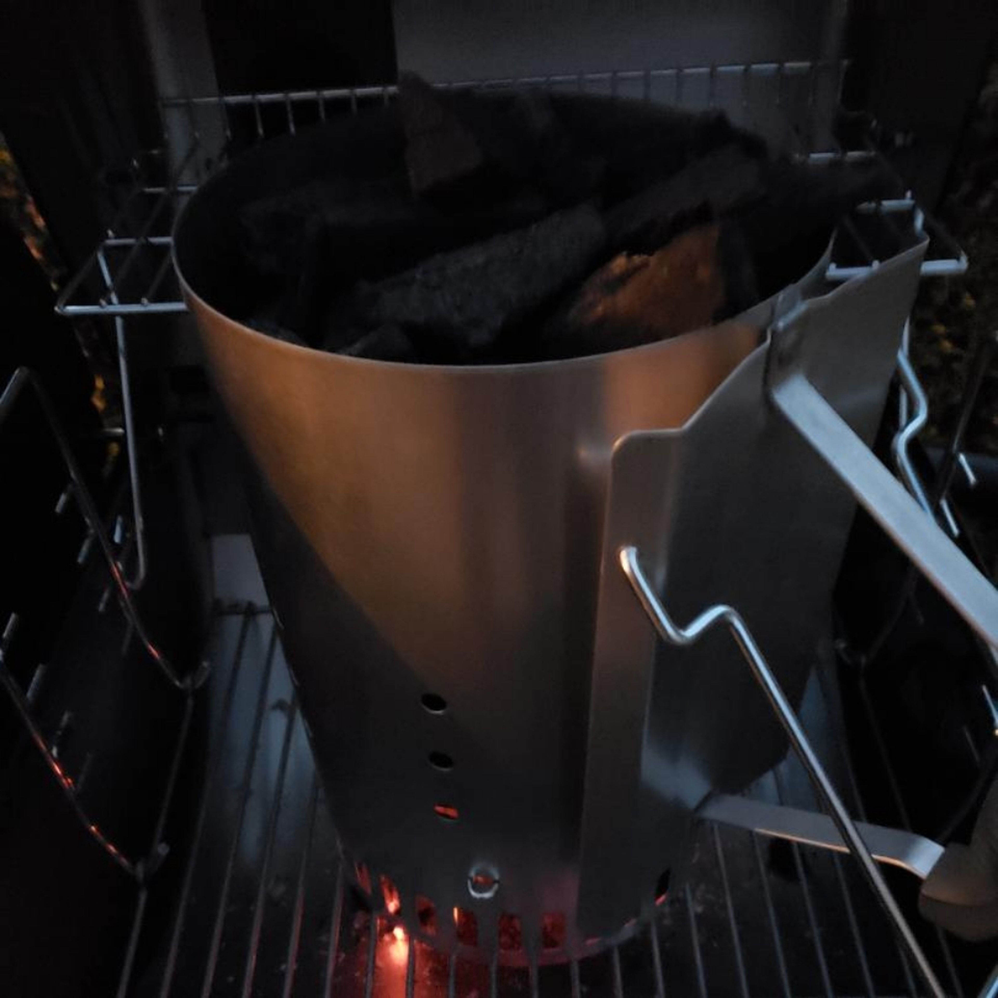 Light charcoal with a chimney starter *DO NOT USE LIGHTER FLUID!* just a suggestion, but not really. let steaks come to room temp while fire goes. Dump coals when white hot and cover grill, allowing grates to heat.