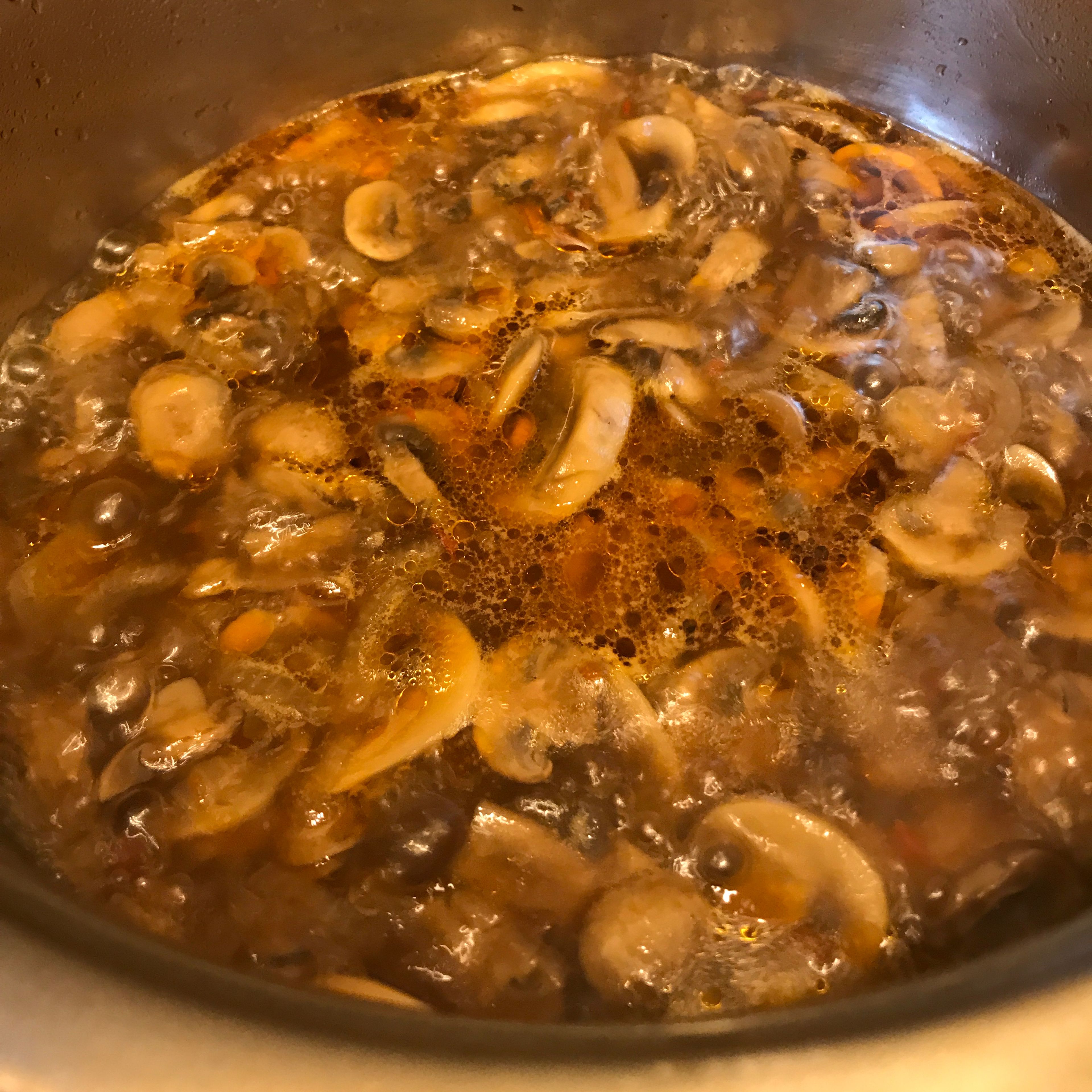 After half an hour the mushrooms will be covered with water because they contain also water. Now we wait for another 30 minutes for the water to evaporate throw boiling. 