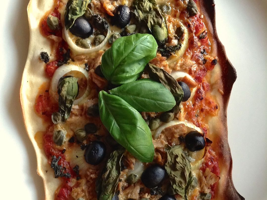 Pizza with capers, tuna, and olives