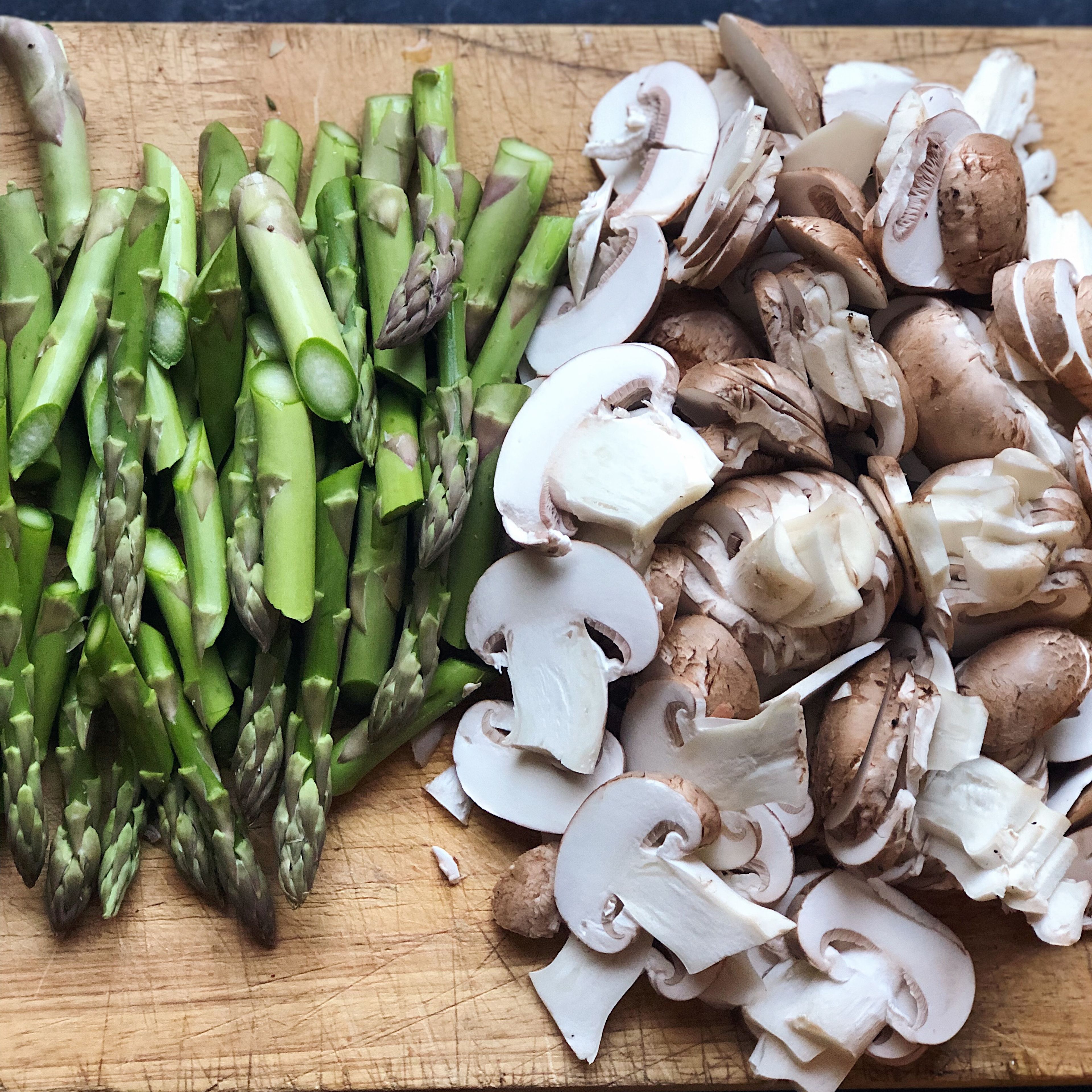 While sweating onions, roughly chop the mushrooms and asparagus