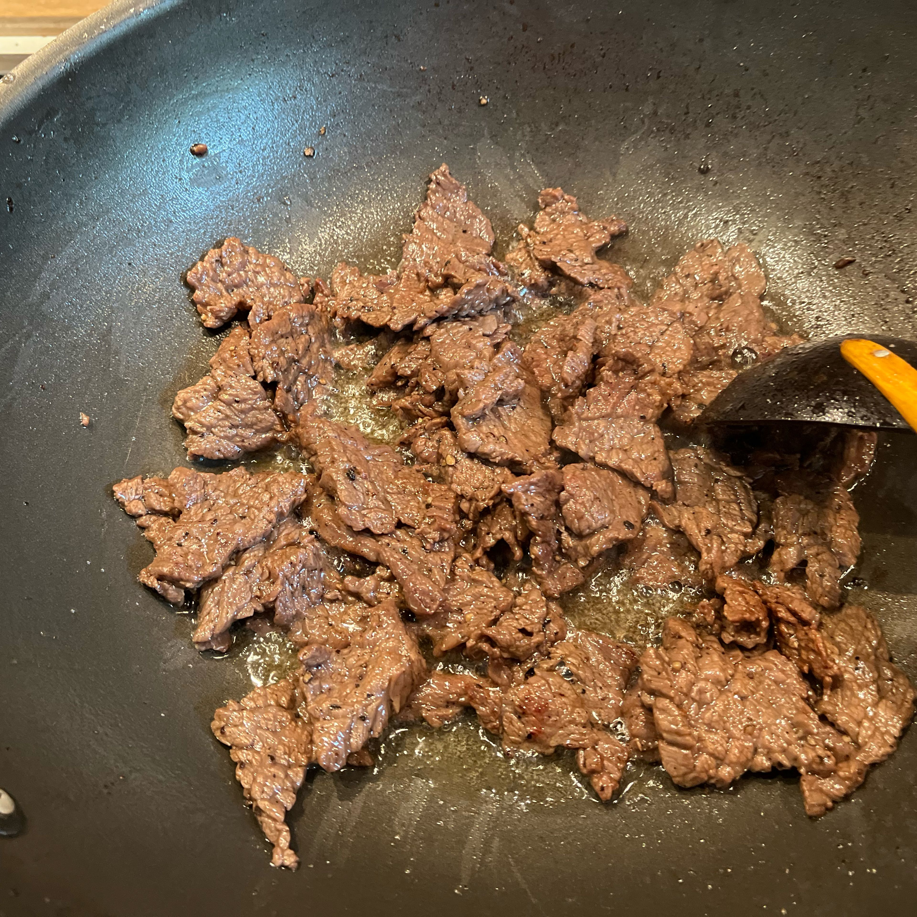 Fry marinated beef until brown.
