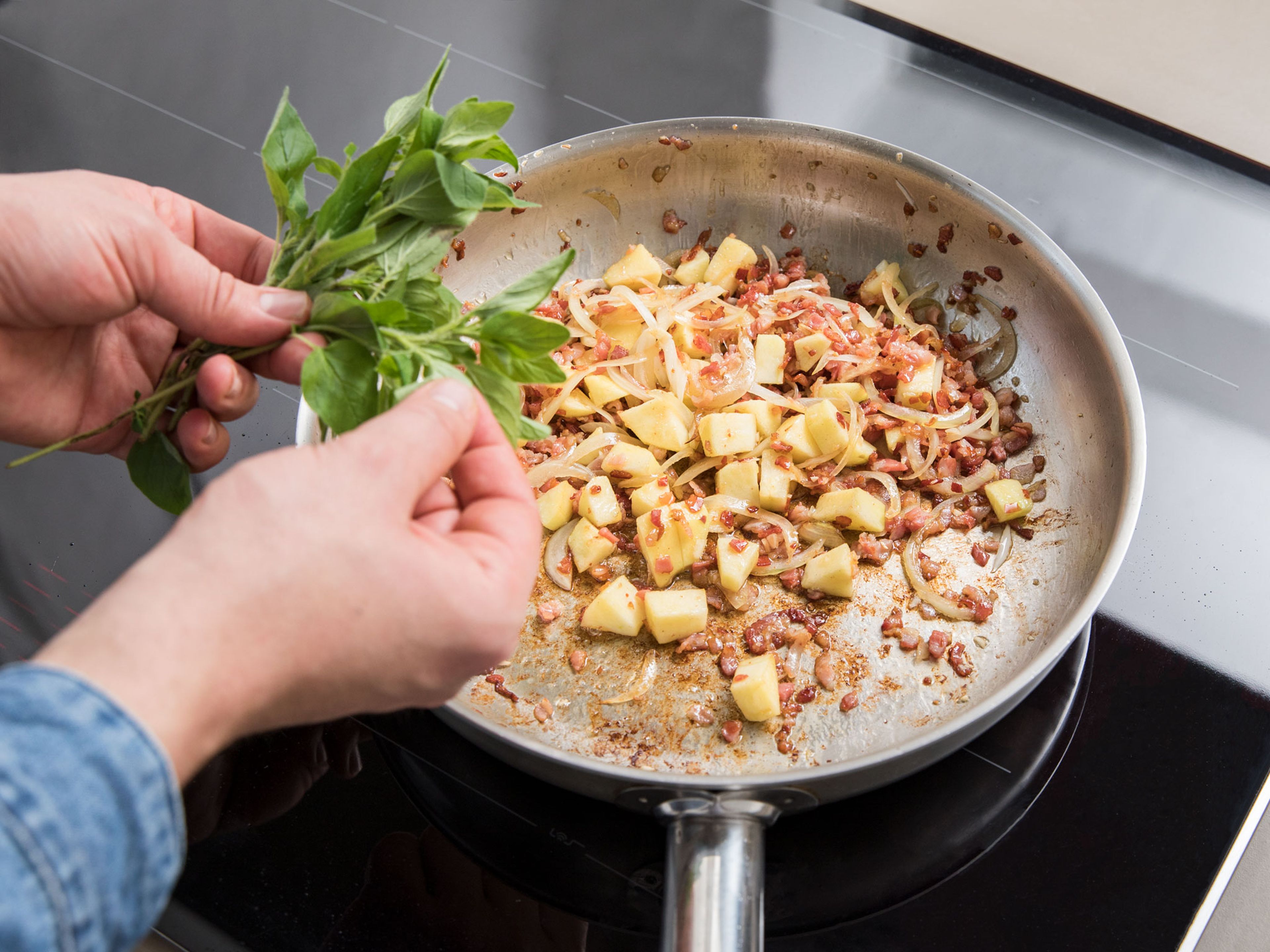 Heat oil in a frying pan. Add bacon and let render. Add garlic, onion, and apple dices and sauté for approx. 2 – 3 min. Add honey, marjoram, rutabaga, and mustard. Toss to combine.