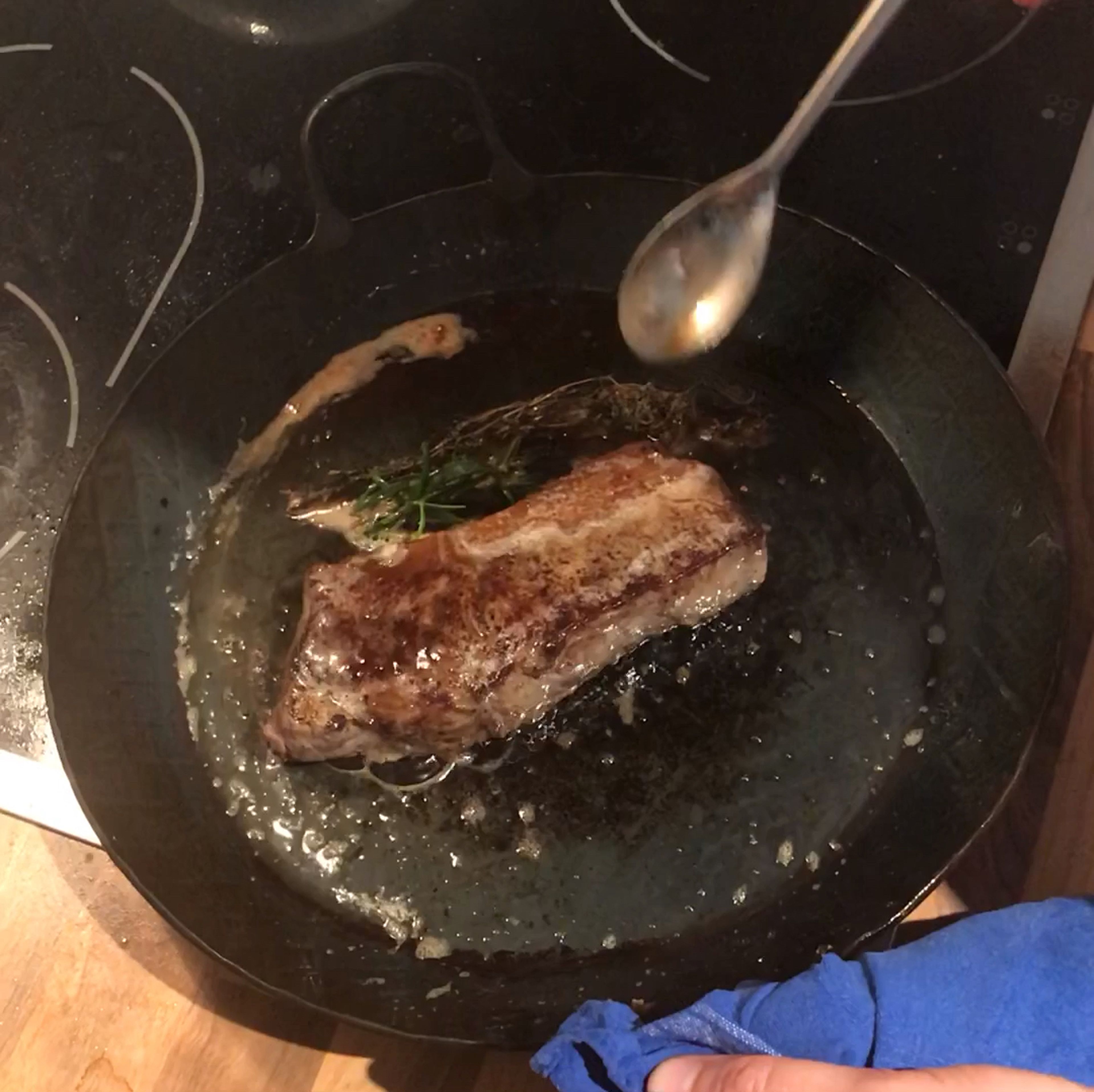 Heat the same pan used to fry the vegetables over medium-high heat. Add a bit more oil if needed, and once hot, add the steak. Sear briefly on each side until well browned. Add butter to pan along with herbs and baste steak until cooked to desired doneness (medium-rare recommended).