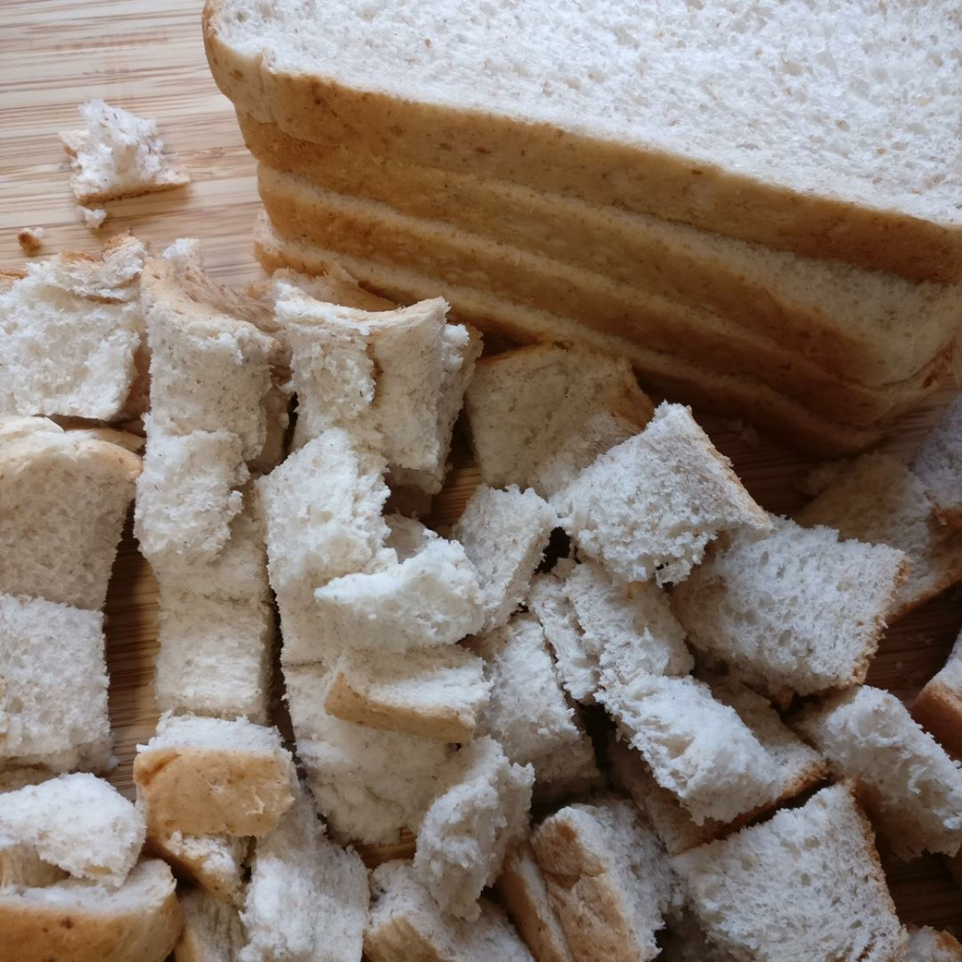 Cut eight bread slices into cubes as shown. Each slice should create approx 20 cubes (4x5).